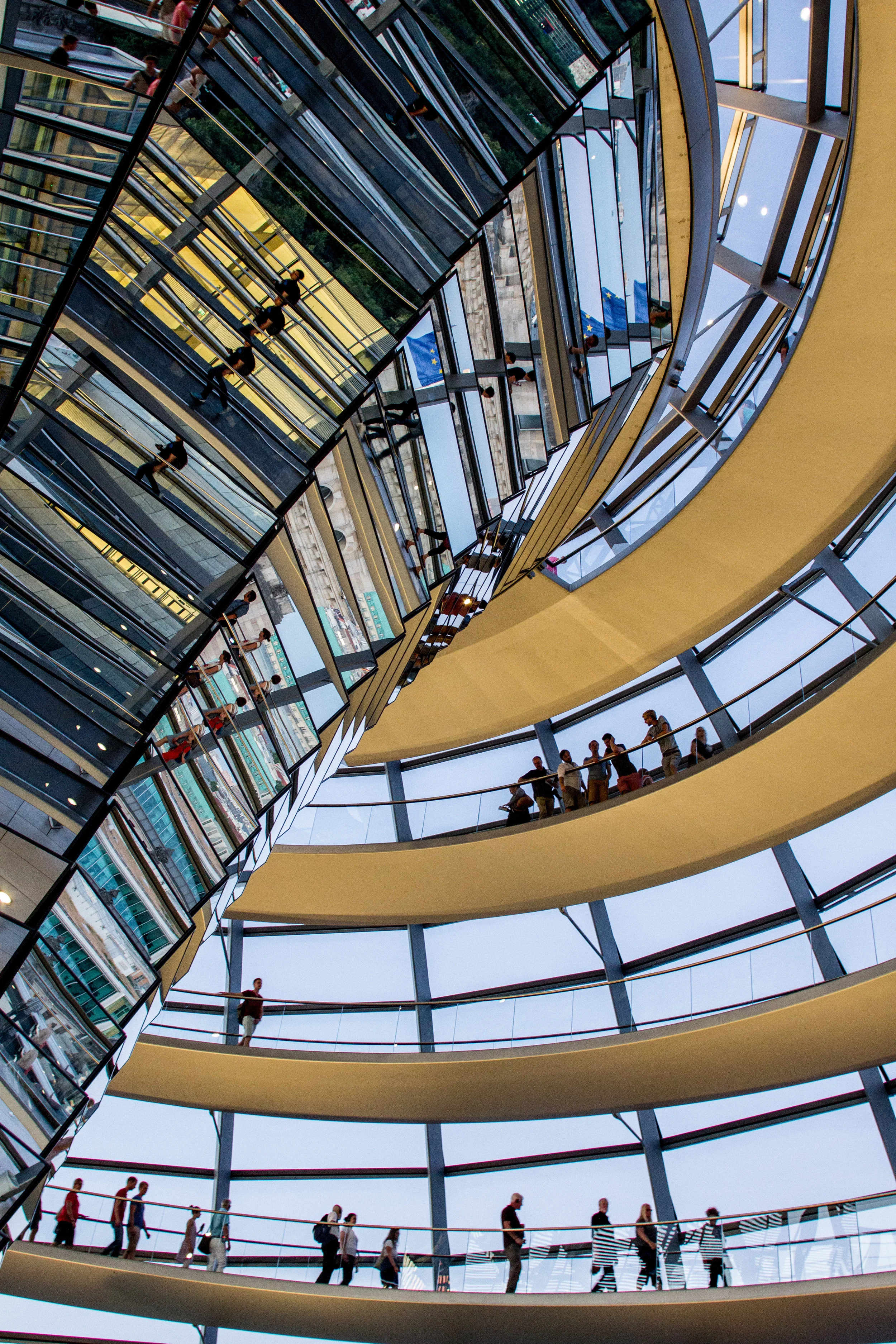 The entire structure of the Reichstag Dome serves as a stairway up to heaven and down to reunification and democracy. Architecture by Norman Foster. Image by John Dawson