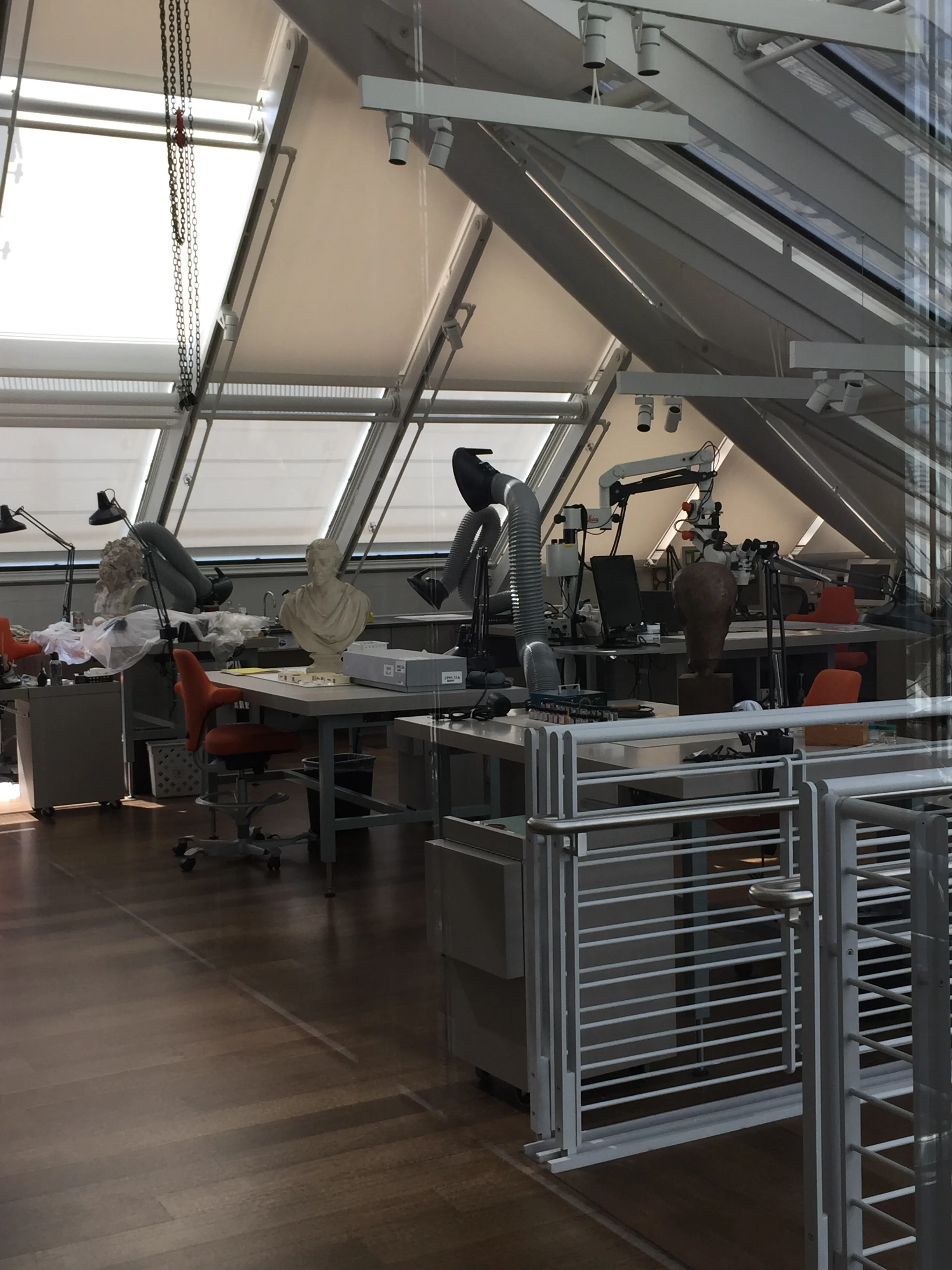 The sculpture conservation workshop is visible to the public and surprisingly flooded with light
