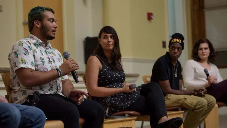 Jay Perry summarized the tenor of a panel discussion on youth homelessness Thursday night. http://www.courant.com/community/hartford/hc-news-hartford-lgbt-youth-discussion-20171017-story.html “It all comes down to this: we have a voice, and it needs to be heard ,” Perry said inside The Lyceum. “People who run the system make their voices heard and speak freely. We should be able to, too.” Perry’s comment came at the height of an intimate, illuminating talk about one of the state’s most vulnerable populations: LGBTQ homeless youth. The panel, organized by the Melville Charitable Trust, brought stakeholders in the supportive-housing system together with some of those youth themselves to mend gaps in understanding and empathy. High school teachers, shelter workers and youth-group organizers sought out the conversation, hosted by Ryan Berg, an author and homeless-youth counselor. “These young people often have been neglected by their families and traumatized by public systems that leave them alienated ,” said Aimee Hendrigan, the vice president of Melville, a New Haven-based nonprofit. “Discussion likes these are so much more relevant in this political climate, where we’re seeing protections stripped away from LGBT people.” The Connecticut Coalition To End Homelessness estimates that 4,396 youth under 25 are “homeless or unstably housed,” according to a May report . And within that number, 23 percent self-identify as “lesbian, gay, bisexual, transgender, queer, intersex or asexual.” “We know youth can’t be the token seat at the table,” Hendrigan said. “We have to hear their voices, listen to their voices and take their input into our planning.” At Thursday’s panel discussion, no topic was off limits. Like Angel Cotto, who once ran away from home to escape the physical and mental abuse he was facing. Who would join every club he could at school to delay and limit that time there. Even after being hospitalized because of that abuse, he said, he still had no other choice. “It was a missed opportunity, there were other places I could go, but I was always brought back home,” he said. “We have all of these rights available to us, but sometimes, we either aren’t told about them, or they aren’t extended to us.” Other panel members shared personal stories of suicide attempts, of the feelings of hopelessness that precede them when caretakers don’t understand the issues teens are facing. “When you’ve turned to every person you think you can turn to, you stop seeking help because you think no one can listen; it’s a cry for help for so many people,” Natalie Garcia, another member of the hub said. “It could be as simple as a place where you can be yourself. A place to have that baseline of space where you can feel comfortable.” But the suggestion the panelists stressed the most was that of inclusion and reflection. “More places need to pull people who have lived the experience,” Perry said. “It’s like going to a church for the first time; you’re going to have to ask what’s going on before you can do anything.” Perry said that LGBTQ youth “always go through this stuff alone.” That they’ve had great success in their own research because of the empathy they wield. “Gay or trans kids don’t want to go to therapy, because they don’t want to have to educate their therapist about what they’re feeling,” Perry said. “No one knows exactly what I’ve gone through. But to have someone whose been in this type of situation, it helps.”