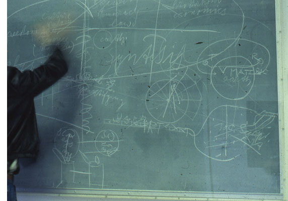 Eyland attempts to erase a blackboard by Joseph Beuys at the Nova Scotia College of Art and Design in 1980. (Fortunately, the blackboard was under glass, because a few years later this 1976 Beuys work was sold the Art Gallery of Ontario in order to support a NSCAD scholarship.)