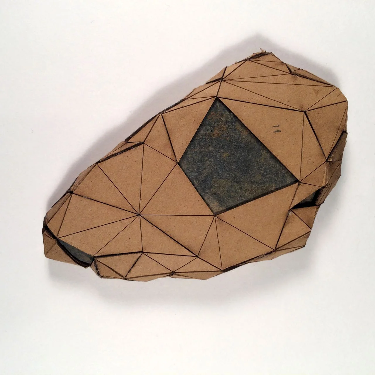 (Front view) 011 - Boxes For Rocks, 2012, laser cut cardboard, found rocks, glue, 13.5cm x 8.5cm x 1.5cm (flat), 250 CAD