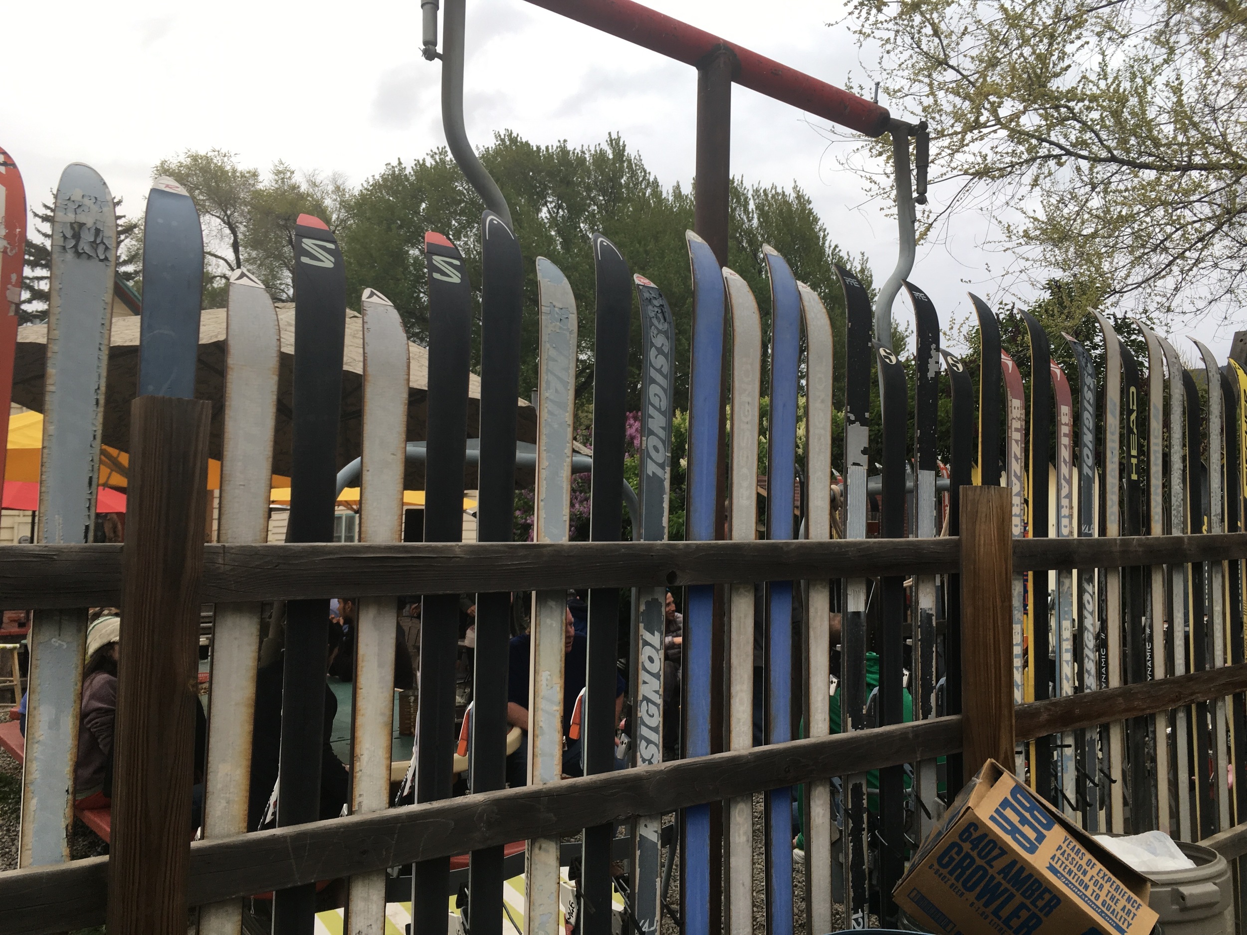 Of course, the fence was made of skis and two seats were fashioned from ski-lifts