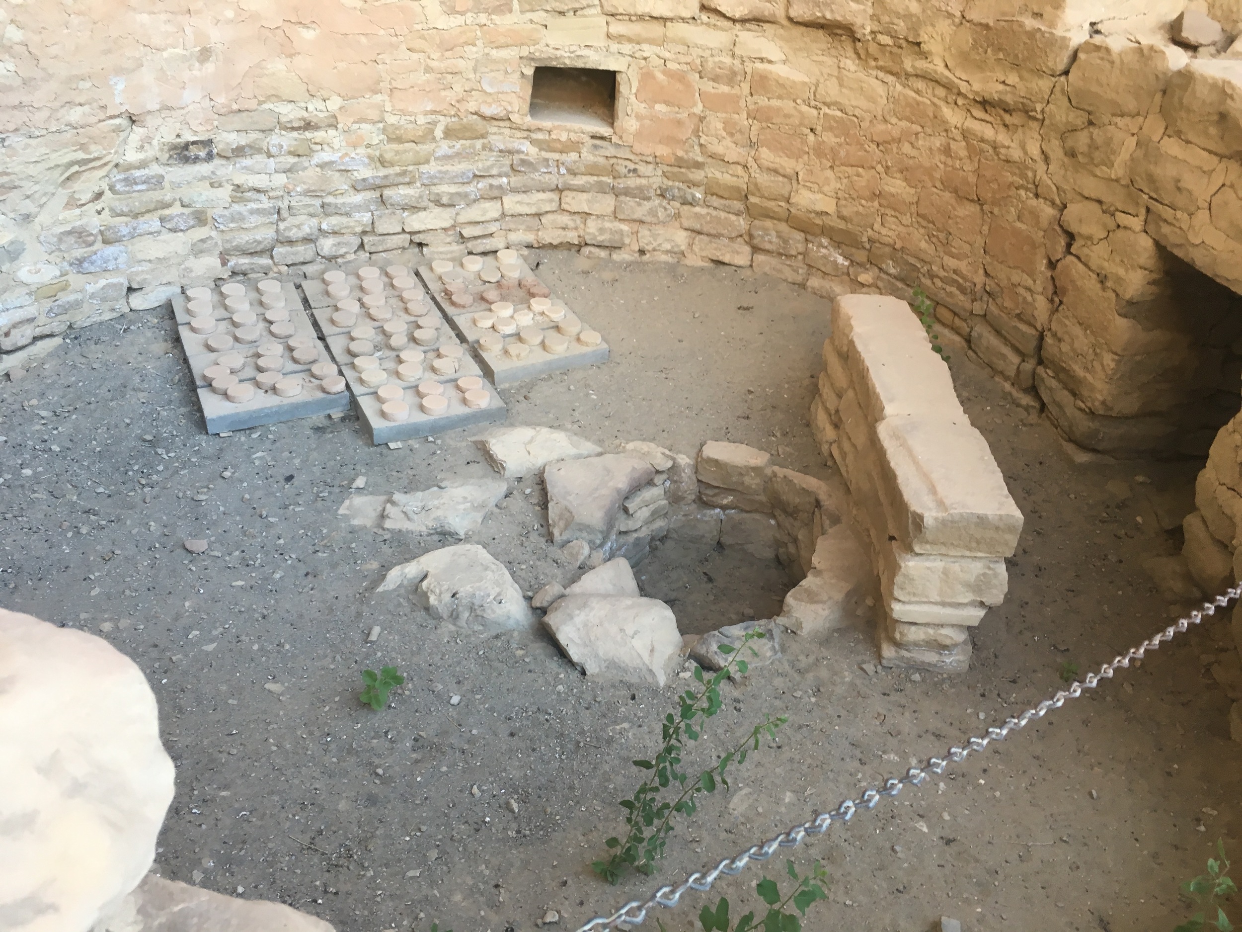 A kiva, one of the circular, ceremonial rooms. In the center is a firepit.
