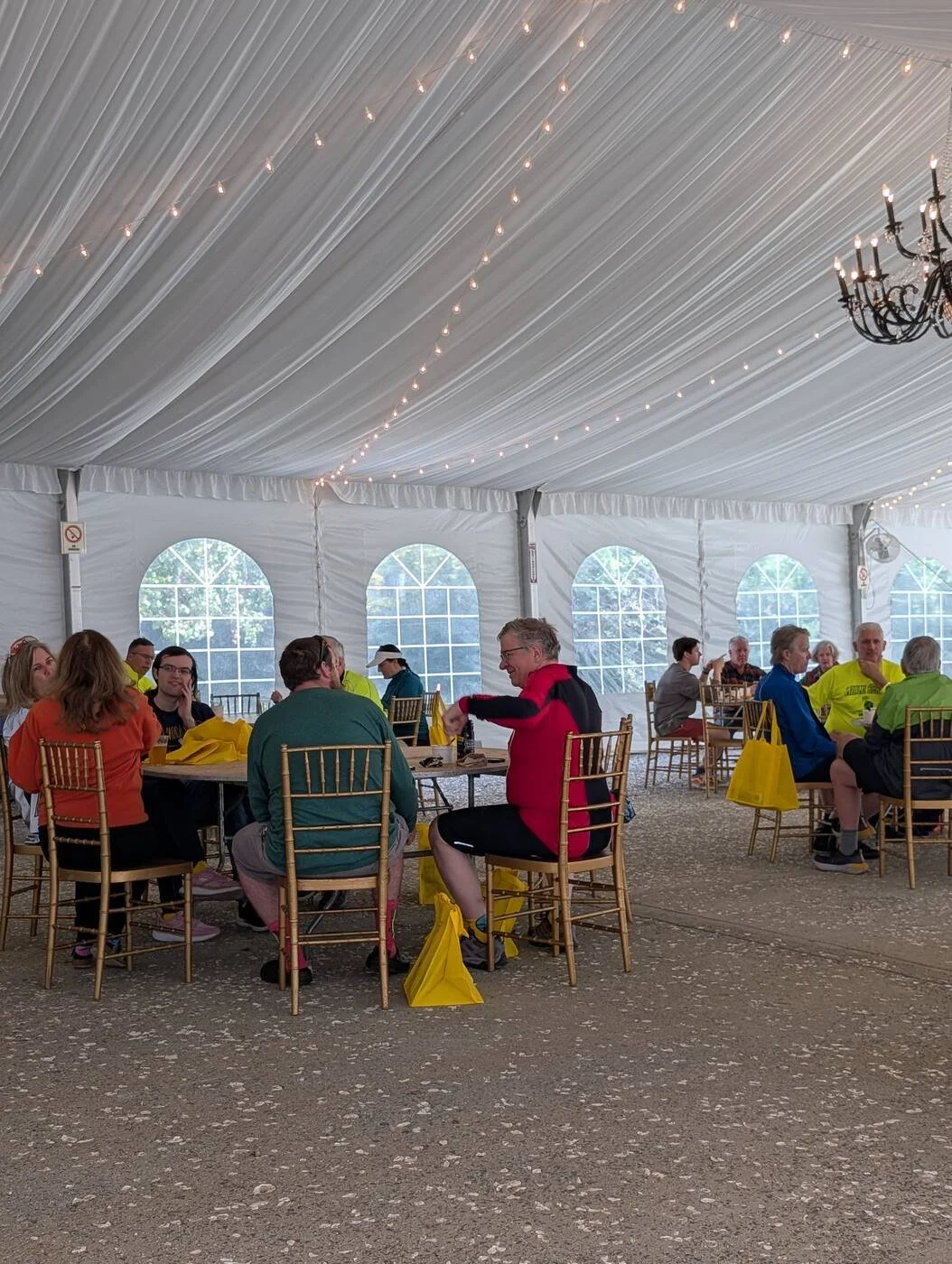 Tour de Mount Vernon cyclists under the tent