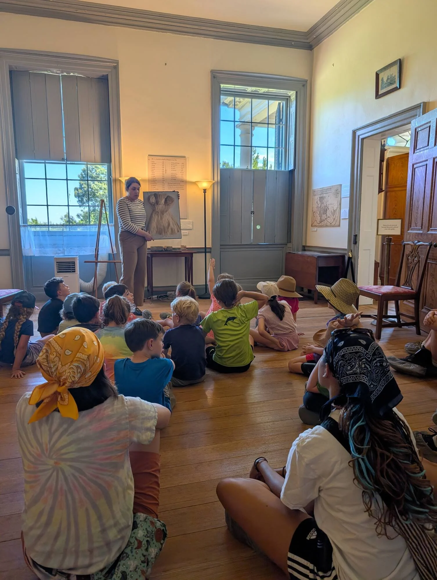 Summer campers at a history talk inside Woodlawn