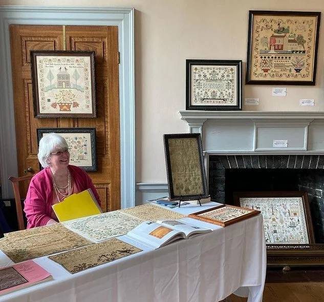 Barbara Hutson presenting historic samplers at Woodlawn