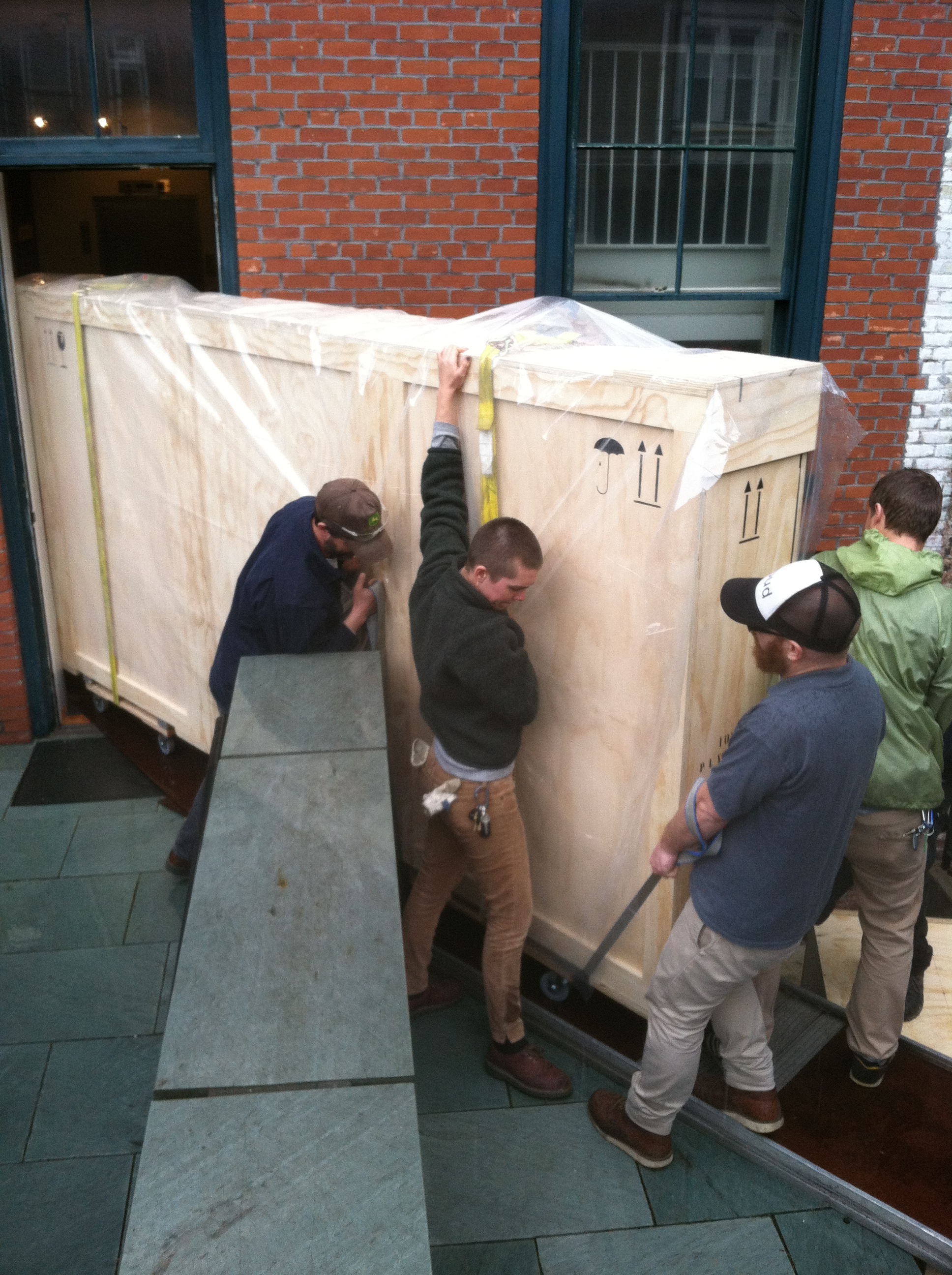 Atelier Art Services staff rounding the corner with the crated Sendak mural at the Rosenbach Museum and Library in mid-April. 