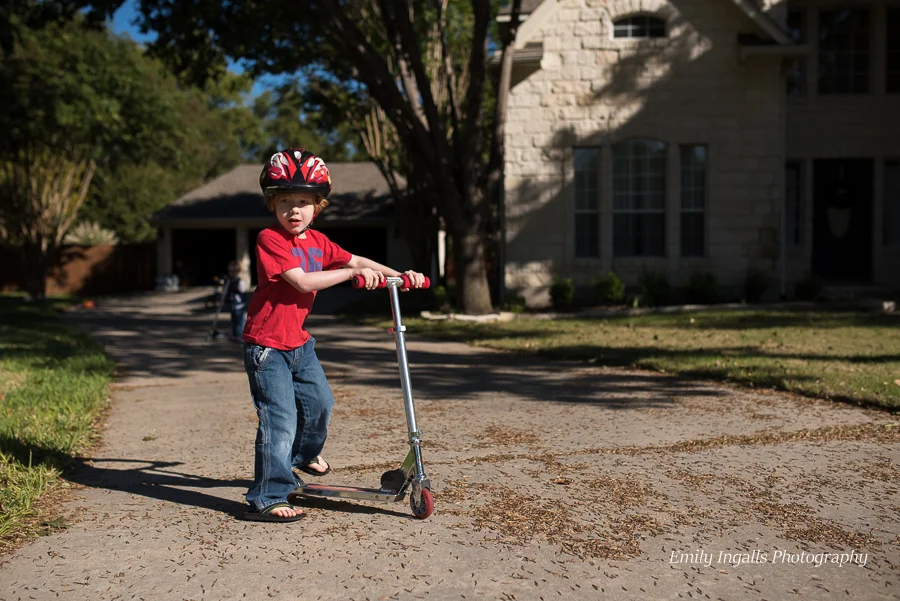 Scootering around on the driveway.