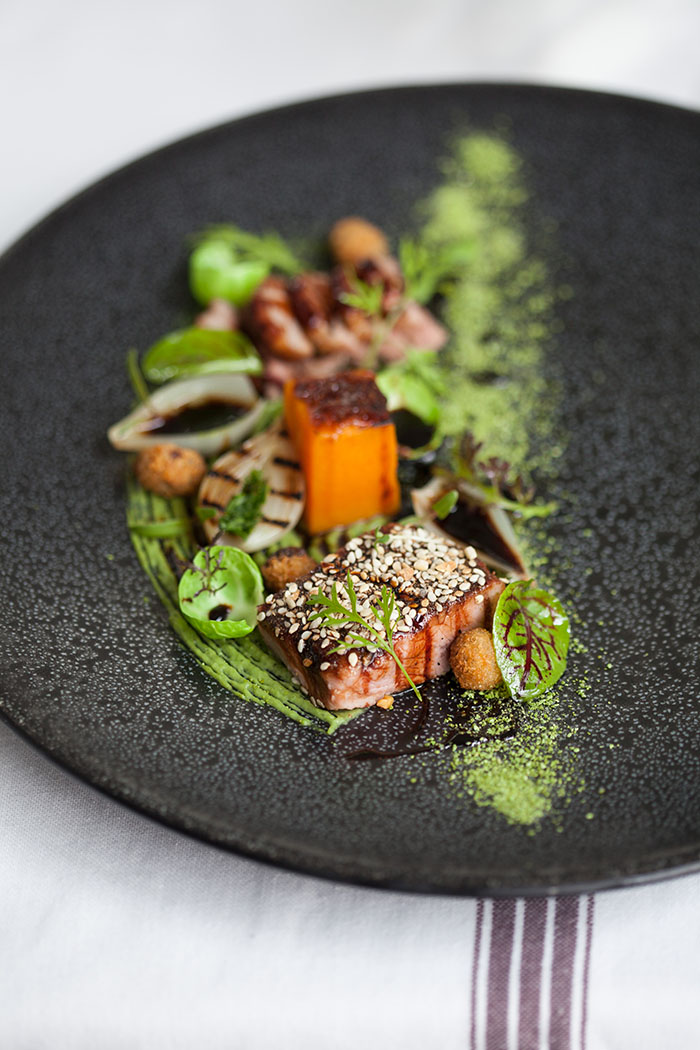 Saddle of lamb variations: minted pea, dukkha-crusted butternut confit, pearl onions, porcini jus