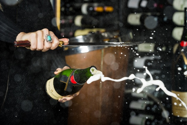 Saber a champagne bottle