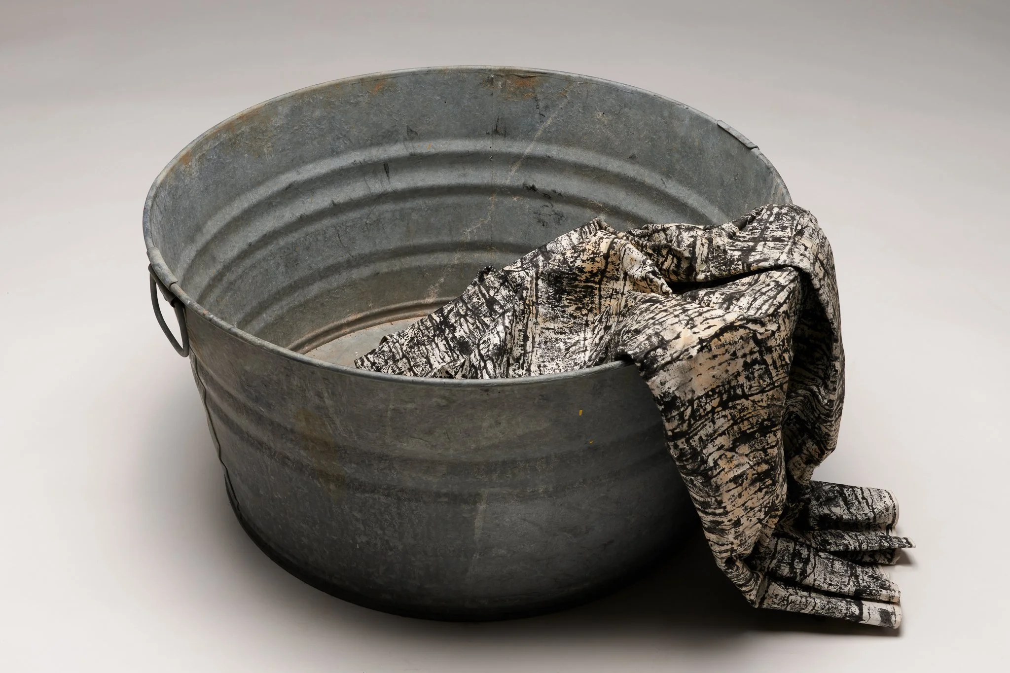  What Remains 1, 2025 vintage galvanized metal washtub, India ink, blotter paper 13” x 22” x 22” 