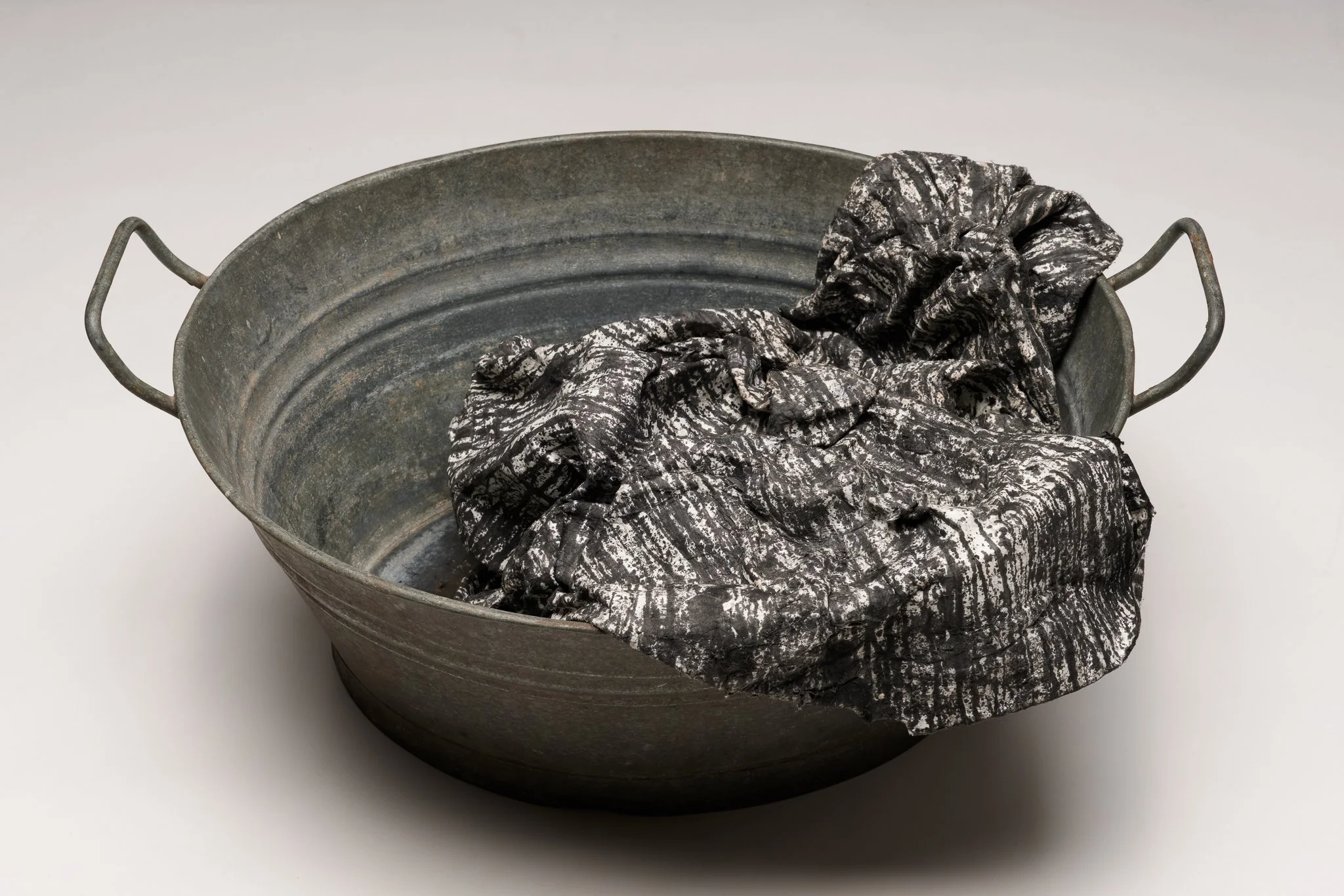  What Remains 3, 2025 vintage galvanized metal washtub, India ink, blotter paper 10” x 22” x 17” 