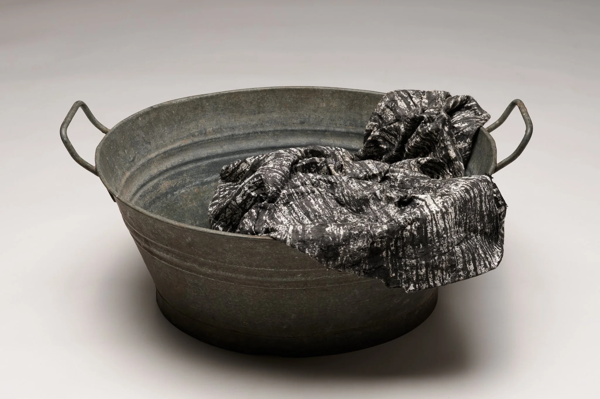  What Remains 3, 2025 vintage galvanized metal washtub, India ink, blotter paper 10” x 22” x 17” 