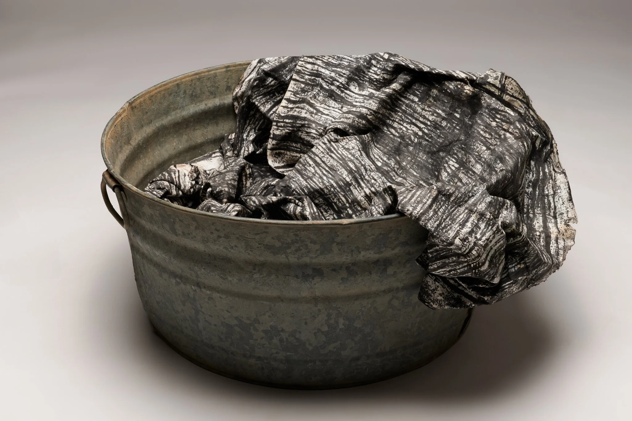  What Remains 4, 2025 vintage galvanized metal washtub, India ink, blotter paper 14” x 30” x 27” 