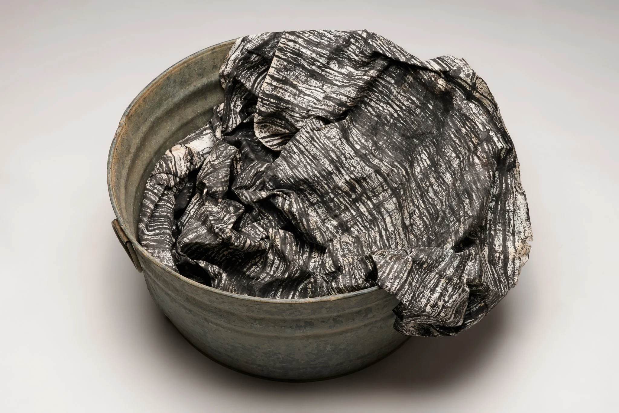  What Remains 4, 2025 vintage galvanized metal washtub, India ink, blotter paper 14” x 30” x 27” 