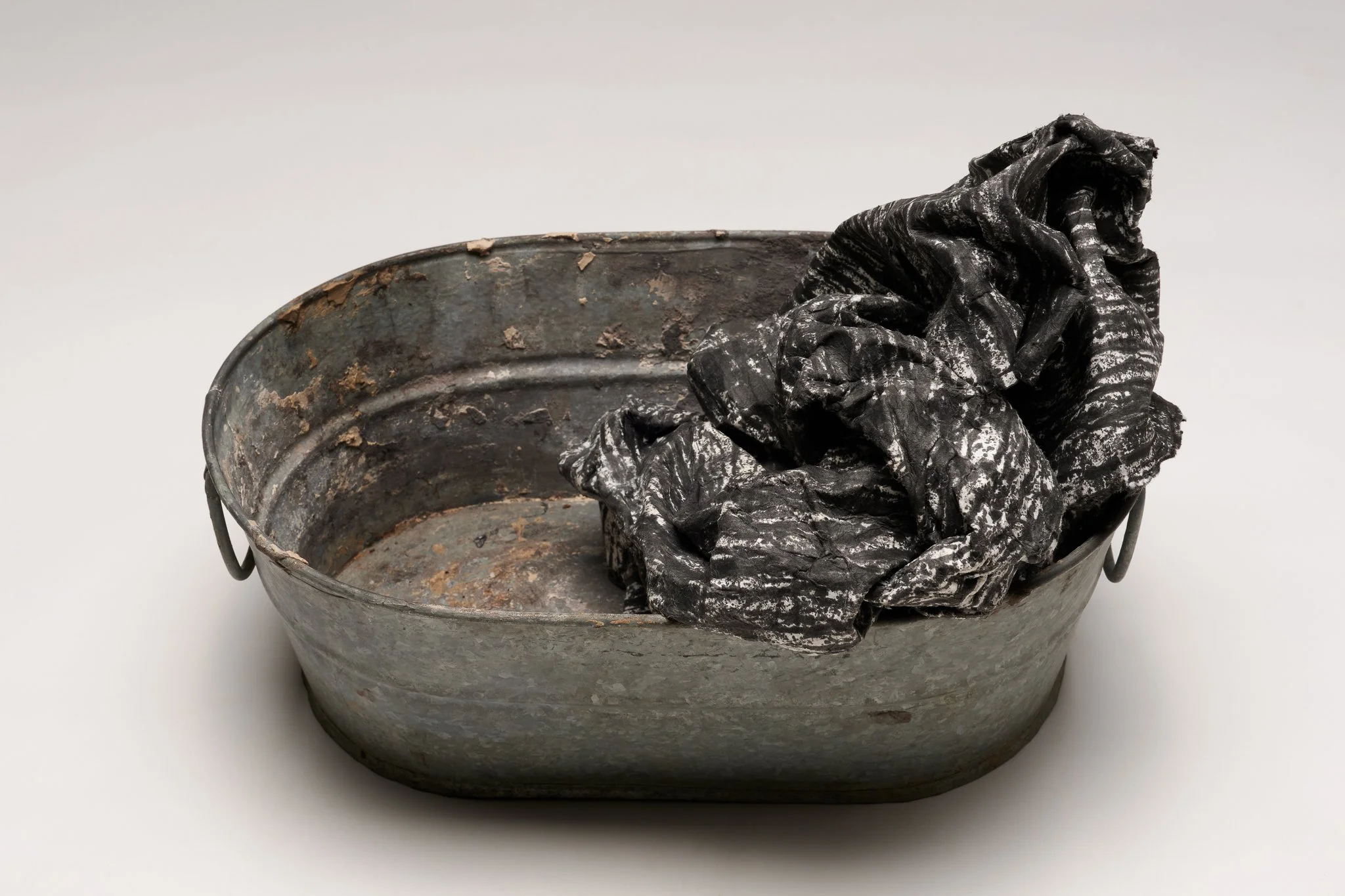  What Remains 5, 2025 vintage galvanized metal washtub, India ink, blotter paper 5.5” x 14” x 10.5” 