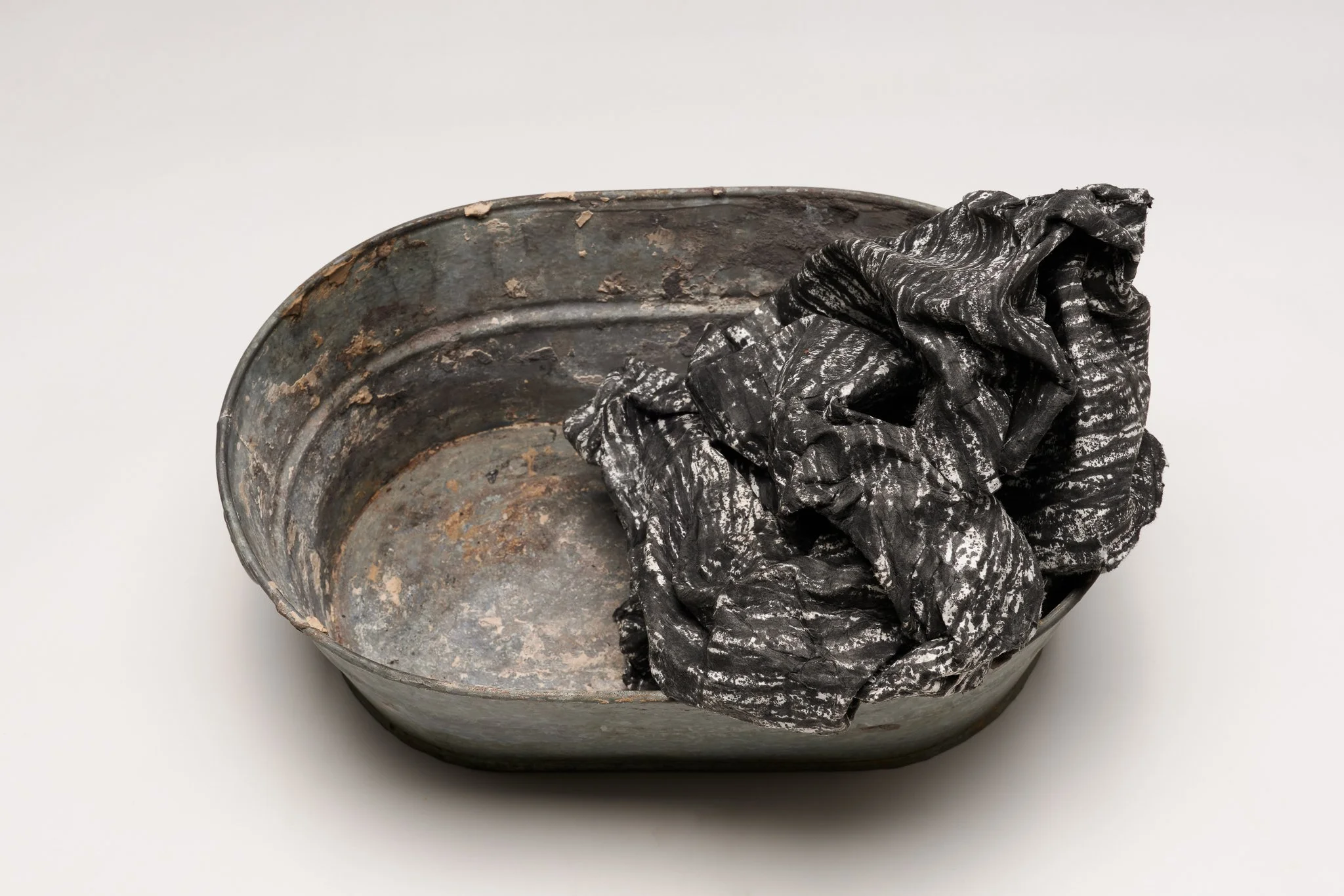  What Remains 5, 2025 vintage galvanized metal washtub, India ink, blotter paper 5.5” x 14” x 10.5” 