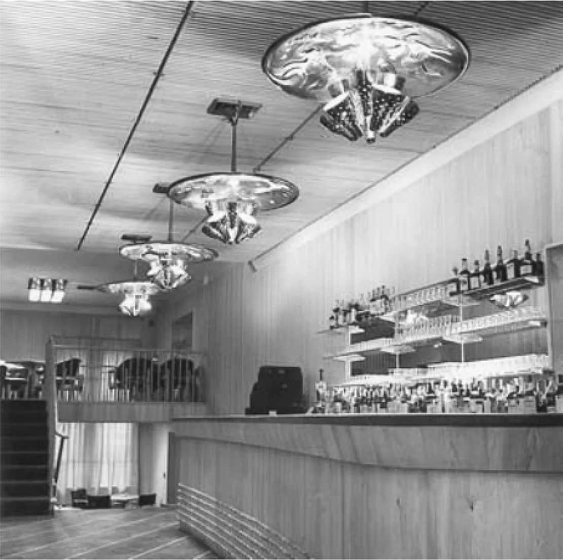 Interior from the Finland House showroom in New York 1948. Ceiling fixtures by Paavo Tynell, interior design by Aarne Ervi.