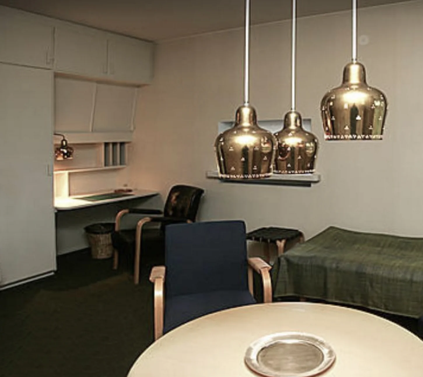 Rare perforated Golden Bell ceiling- and wall lamps, a collaboration between Paavo Tynell and Alvar Aalto, Leppiniemi Guest House, Pyhäkoski, Finland, 1949-1951. Architect Aarne Ervi.