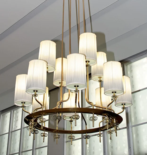 Resturant Laulumiehet, Helsinki, 1949. Monumental brass chandelier with glass diffusers and hand-made silk shades.