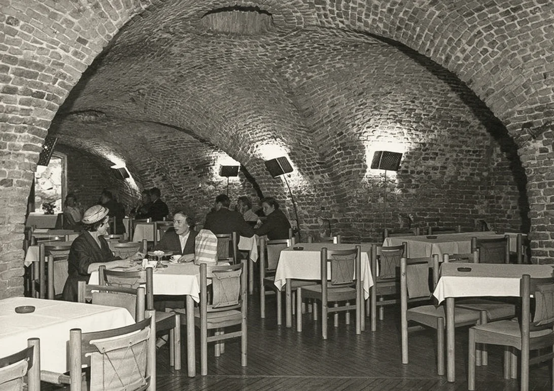Perforated brass wall lamps at the Restaurant Walhalla, Suomenlinna, Helsinki, 1949-1951. Interior architect Aulis Blomstedt.