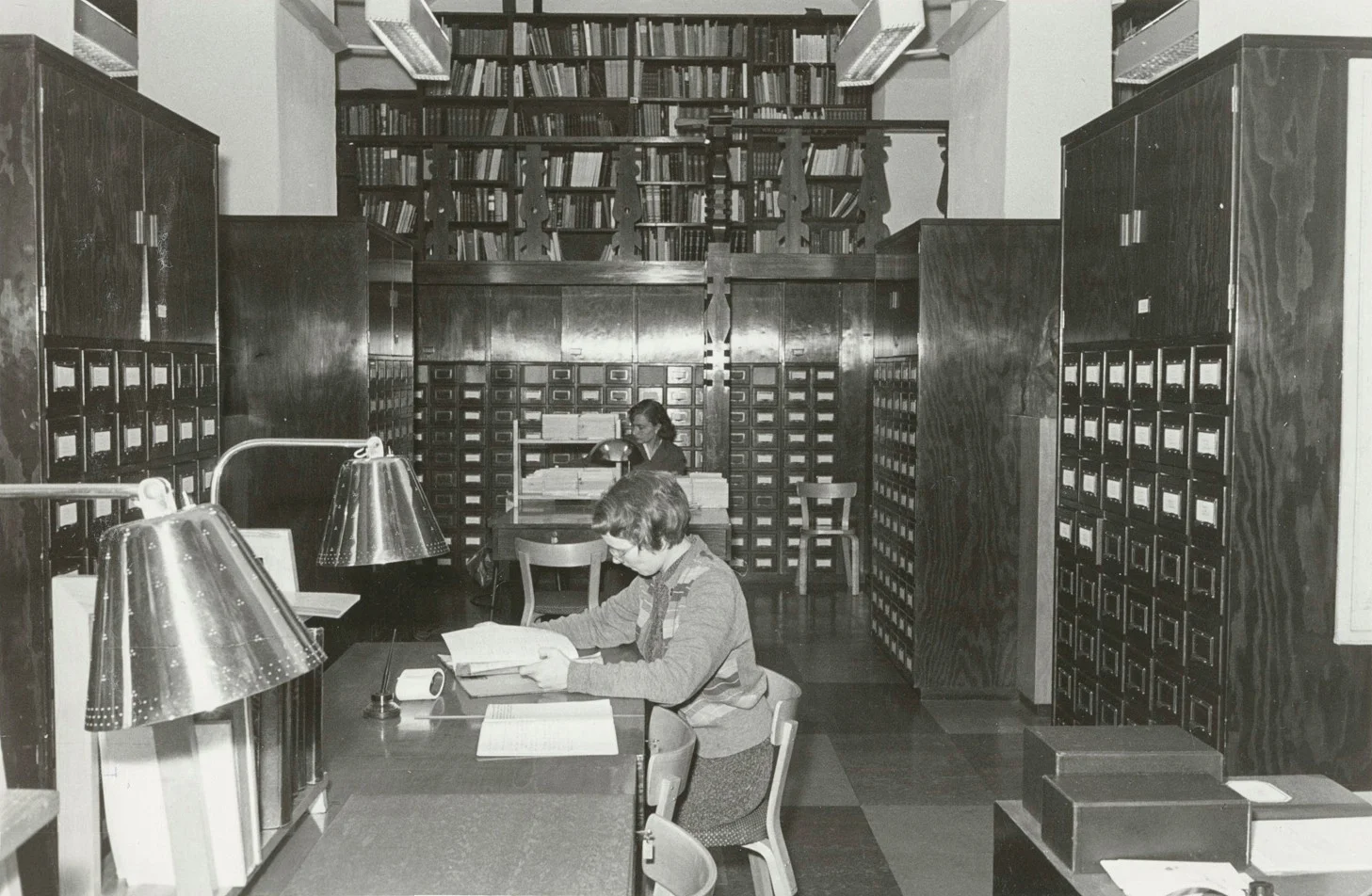 Finnish Literature Society´s Archive Room after renovation in 1950. Perforated brass reading lamps by Tynell and Taito Oy. Image copyright SKS.