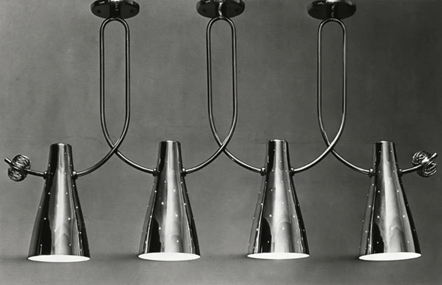 Brass mounted ceiling lamp with four perforated shades and brass decoration, model no. CH/193, Taito Oy. Image copyright by the British Council of Industrial Design.