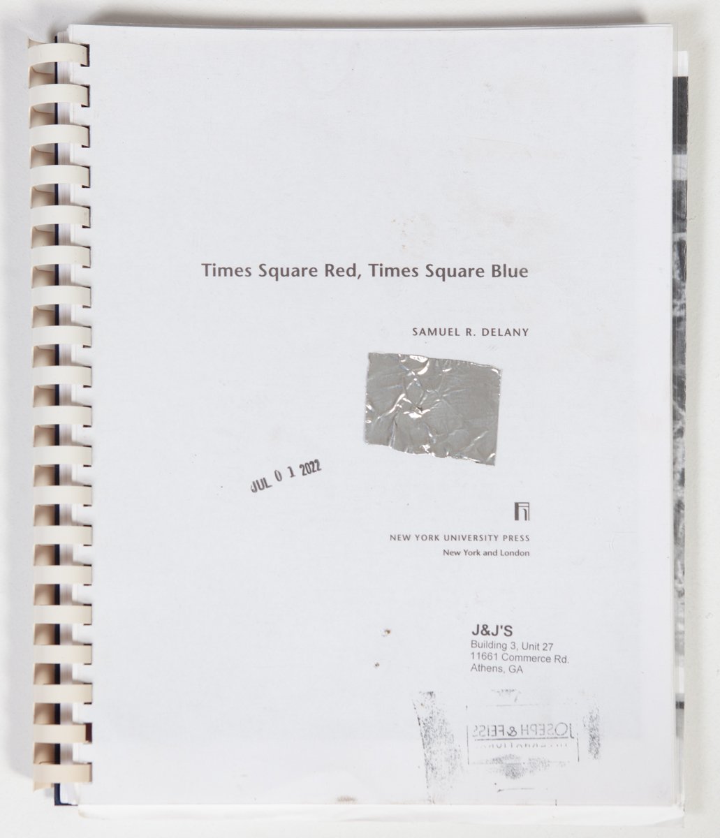  Xerox Reader: Xerox Text (Times Square Red; Times Square Blue); Xerox Images; Toner; Ink; Gelatin Silver Print; Comb-binding; Foil Tape; Self-Inking Stamps and Stamp from Found Object (ROTC recalled footwear from J &amp; J Flea Market)  28" x 11" (U