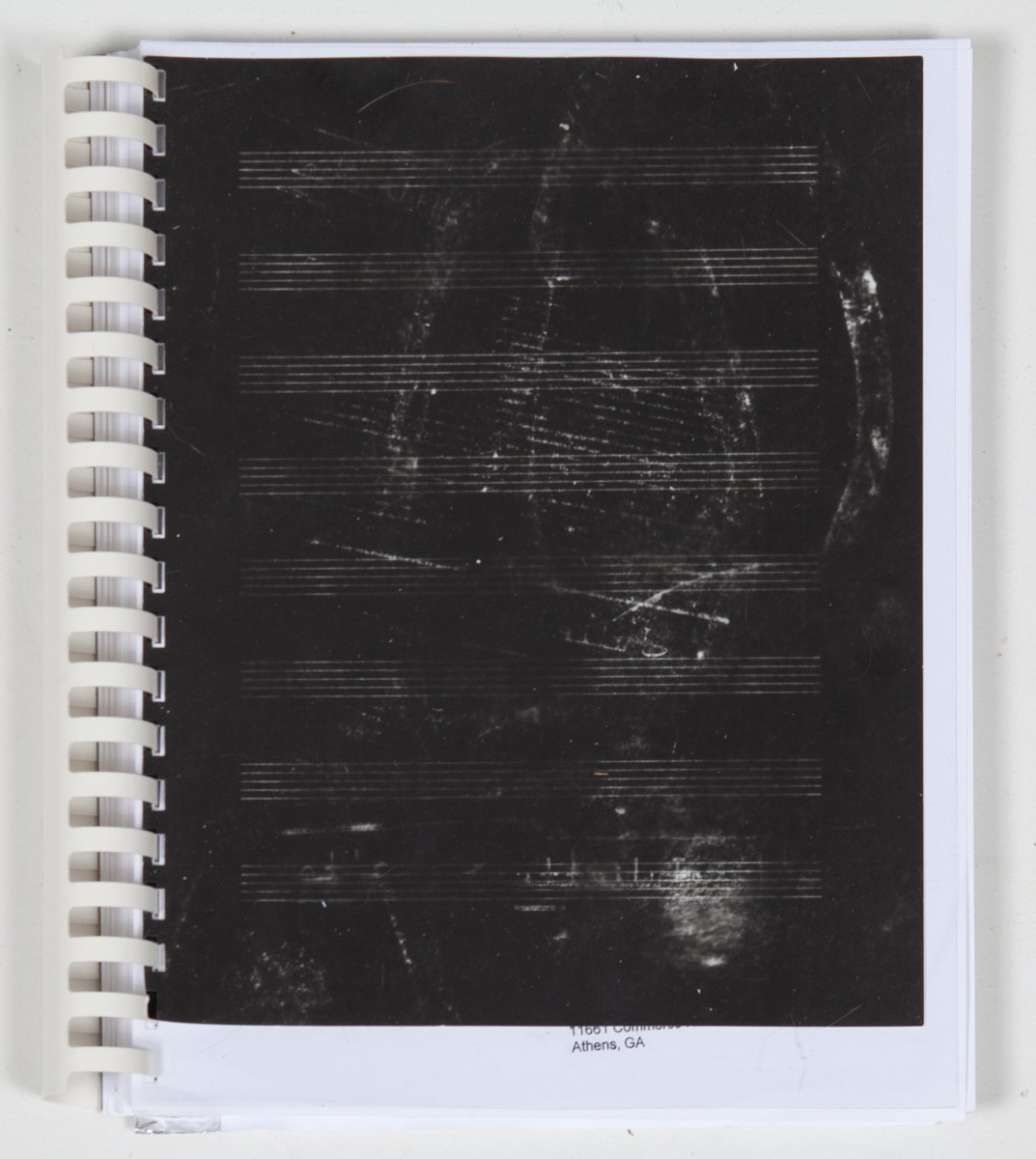 Cover: Gelatin Silver Contact Print prepared from paper "negative" (xerox copy of ink rubbing on sheet music). Reader: Xerox Text (The Life and Death of the Great American City); Xerox Images; Toner; Ink; Comb-binding; Foil Tape; Self-Inking Stamp (