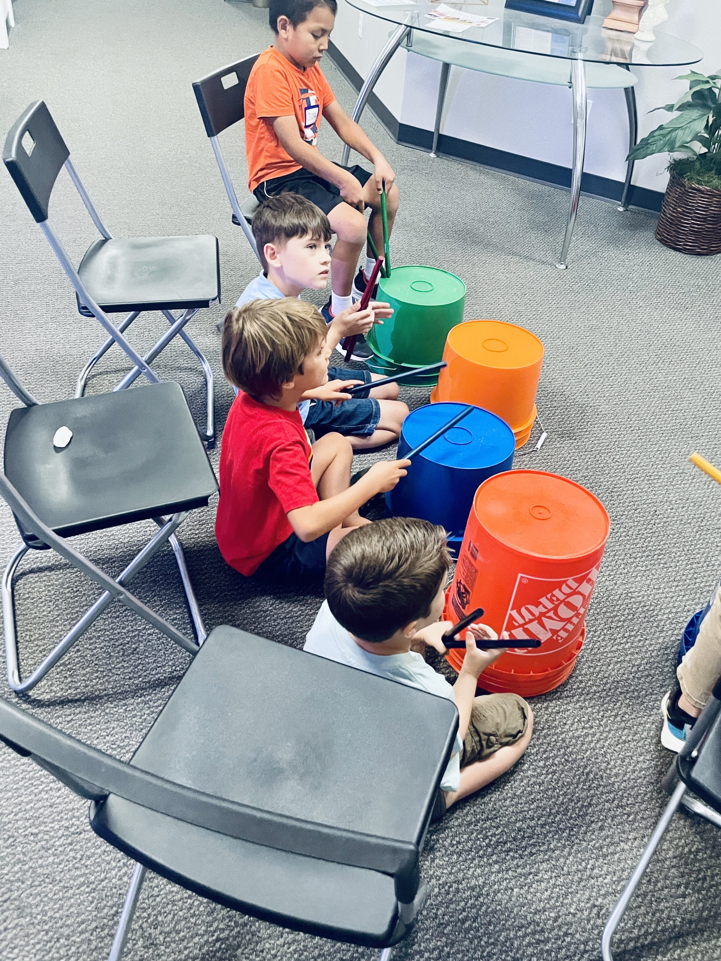 Students learned a full song in bucket drumming