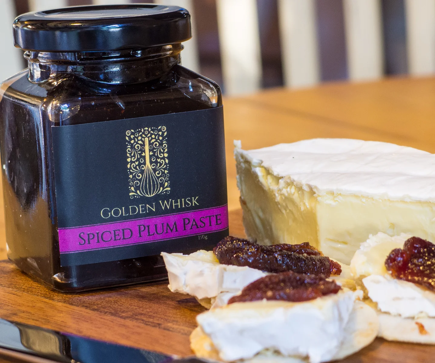 Golden Whisk's Spice Plum Paste, pictured with brie cheese