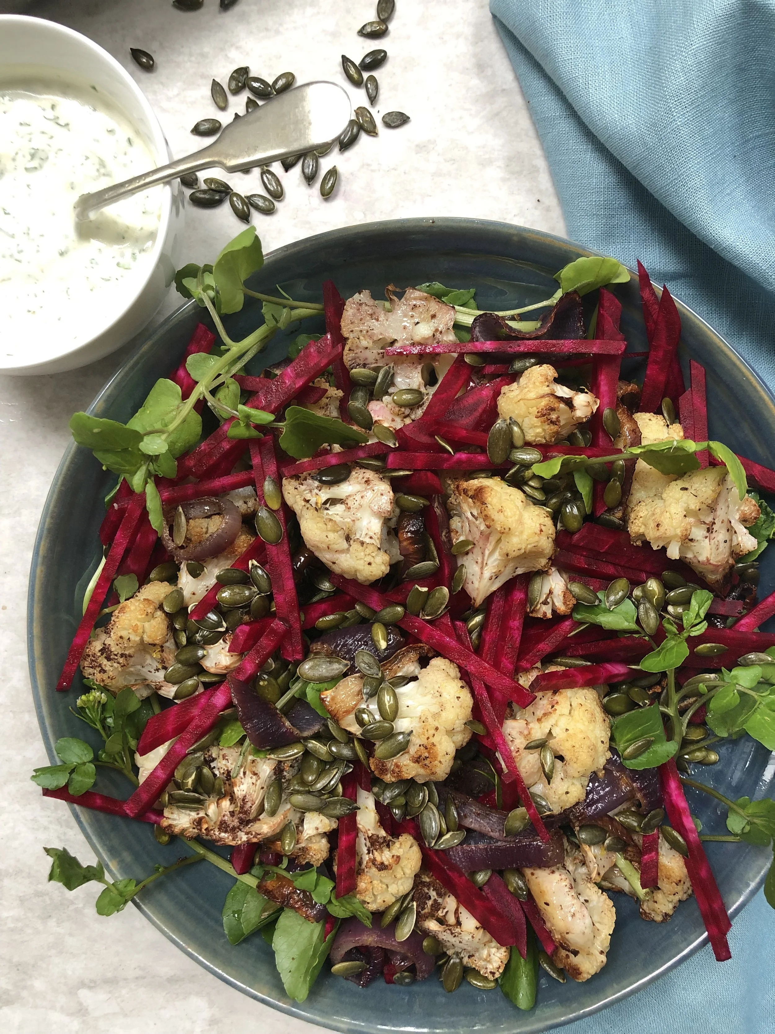 Roasted cauliflower salad with lemony herb yoghurt dressing