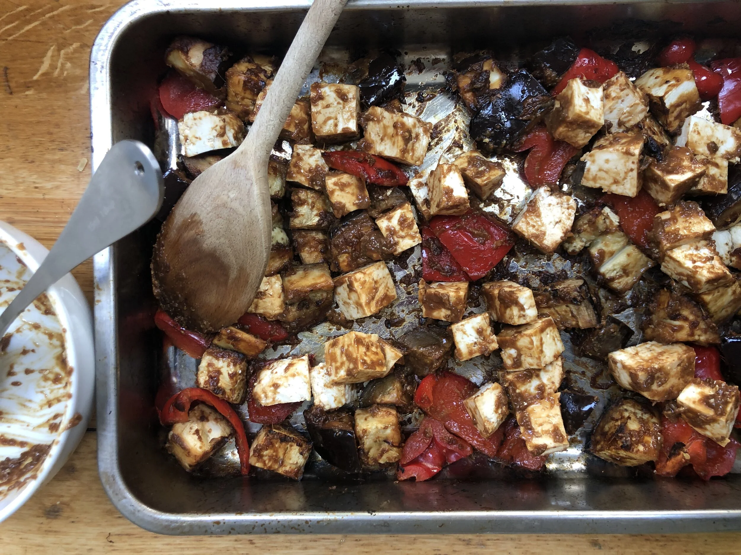 Mix the tofu cubes with the roasted aubergine and pepper and return to the oven