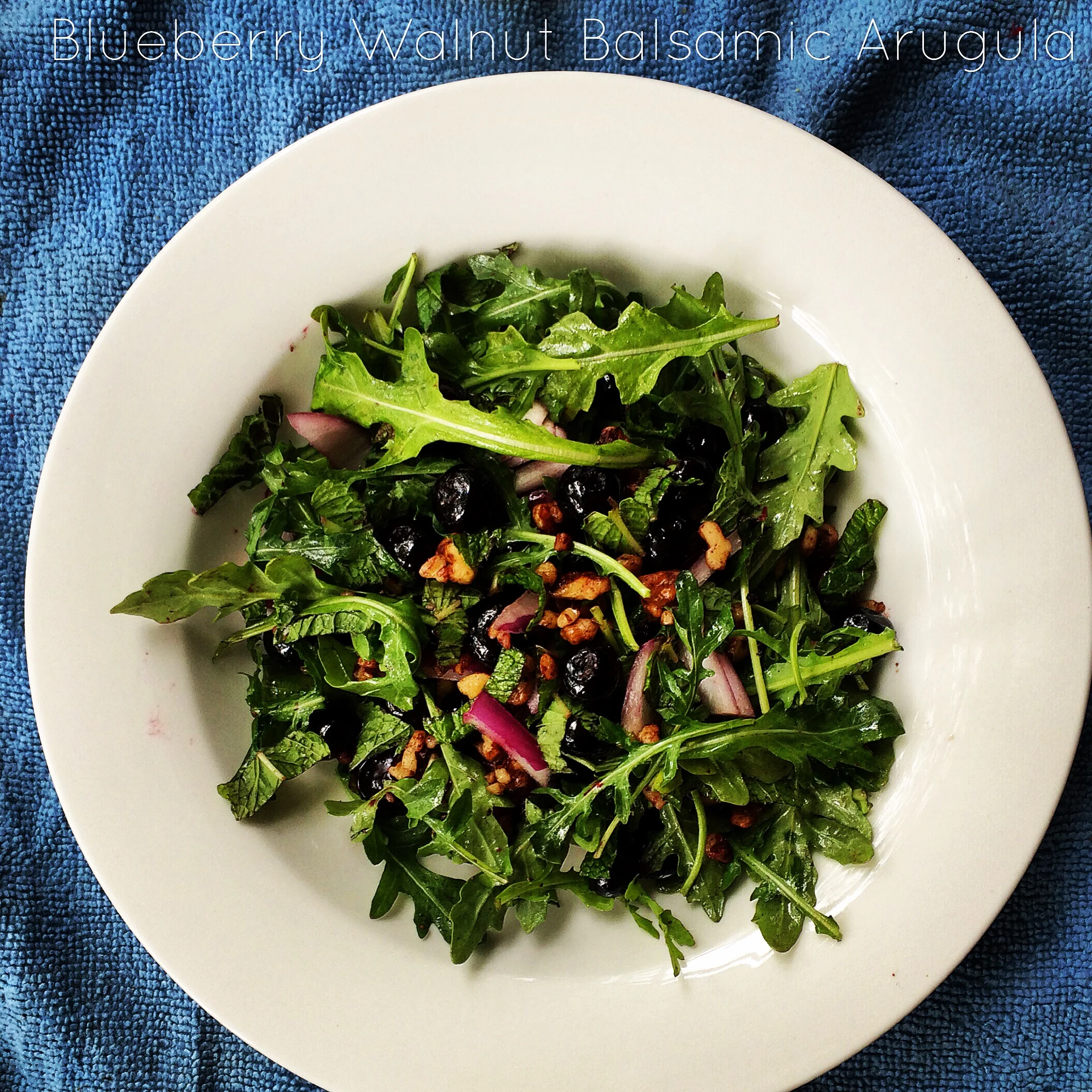 This is the perfect summer salad when berries are ripe and in season and your greens are fresh! Blueberries provide high amounts of anti-inflammatory antioxidants which also give a slightly sweet taste when paired with balsamic vinegar. The toasted walnuts add for a perfect crunch over a bed of peppery arugula. Enjoy this summer bite!! INGREDIENTS: • 1/4 cup walnuts • 2 Tbsp Extra-Virgin Olive Oil • 1-2 Tbsp Balsamic Vinegar • 2 Large Handfuls Arugula (or Spinach) • 1/4 Red Onion, sliced thin • 1 cup blueberries, washed DIRECTIONS: Toast walnuts and olive oil over medium heat in a skillet. While walnuts are roasting (~3 minutes) wash your blueberries and add to a large bowl of arugula (or spinach). Slice you red onion into thin pieces. Go back to the skillet and add blueberries and balsamic vinegar and stir another 1 minute. Serve over the bed of greens and enjoy!