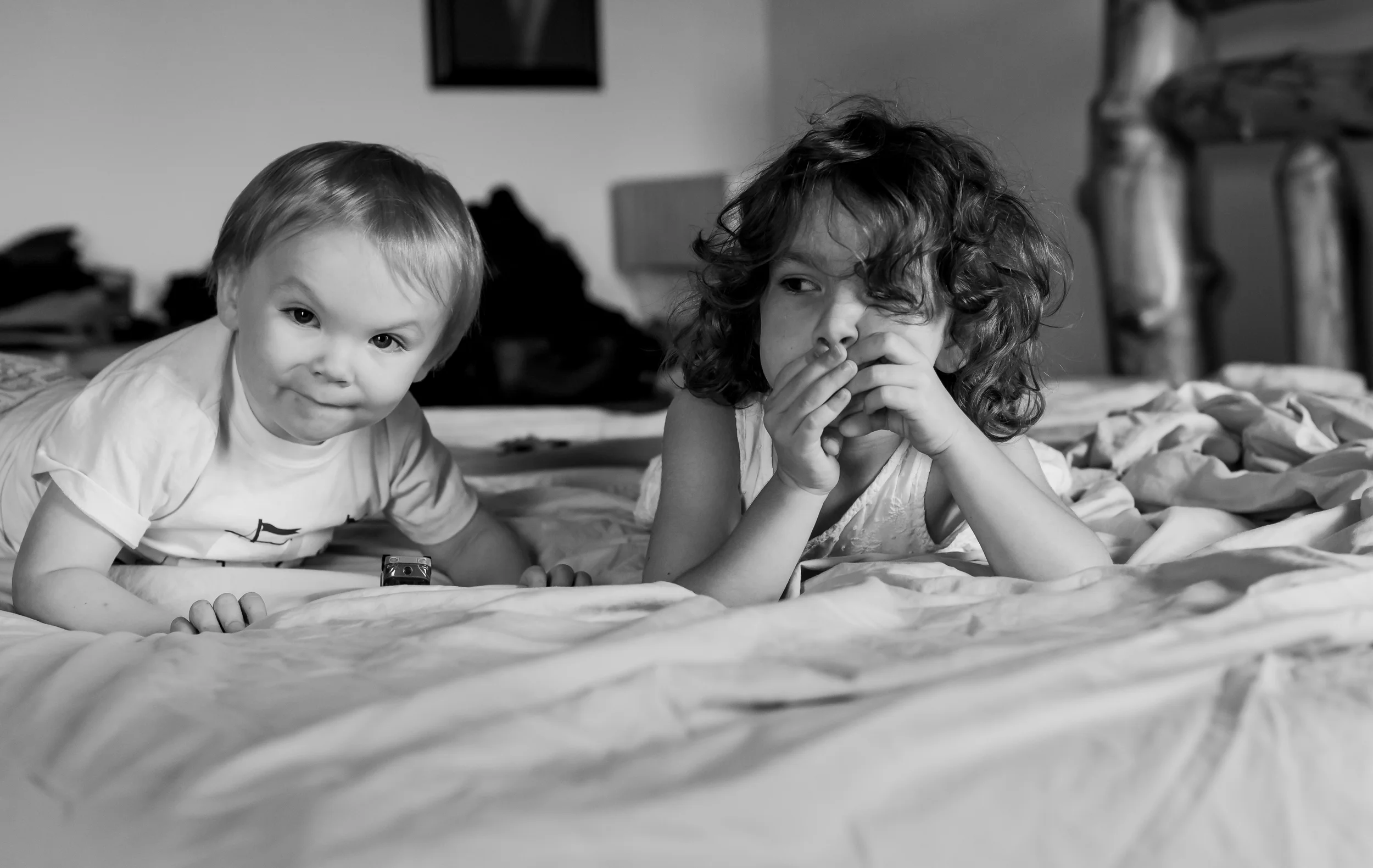 Trying to make my bed with two cuties on it.....