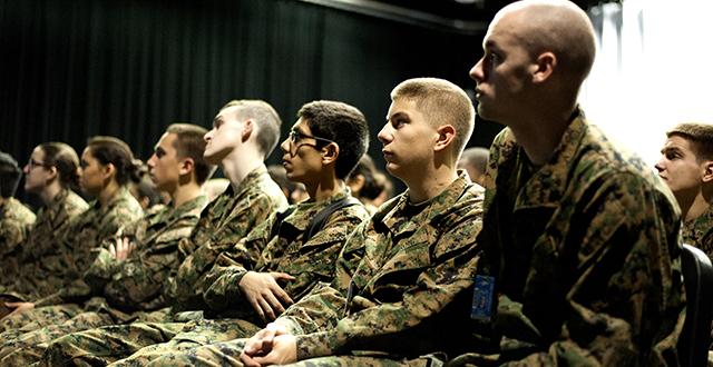 JROTC students listening to veterans speak.