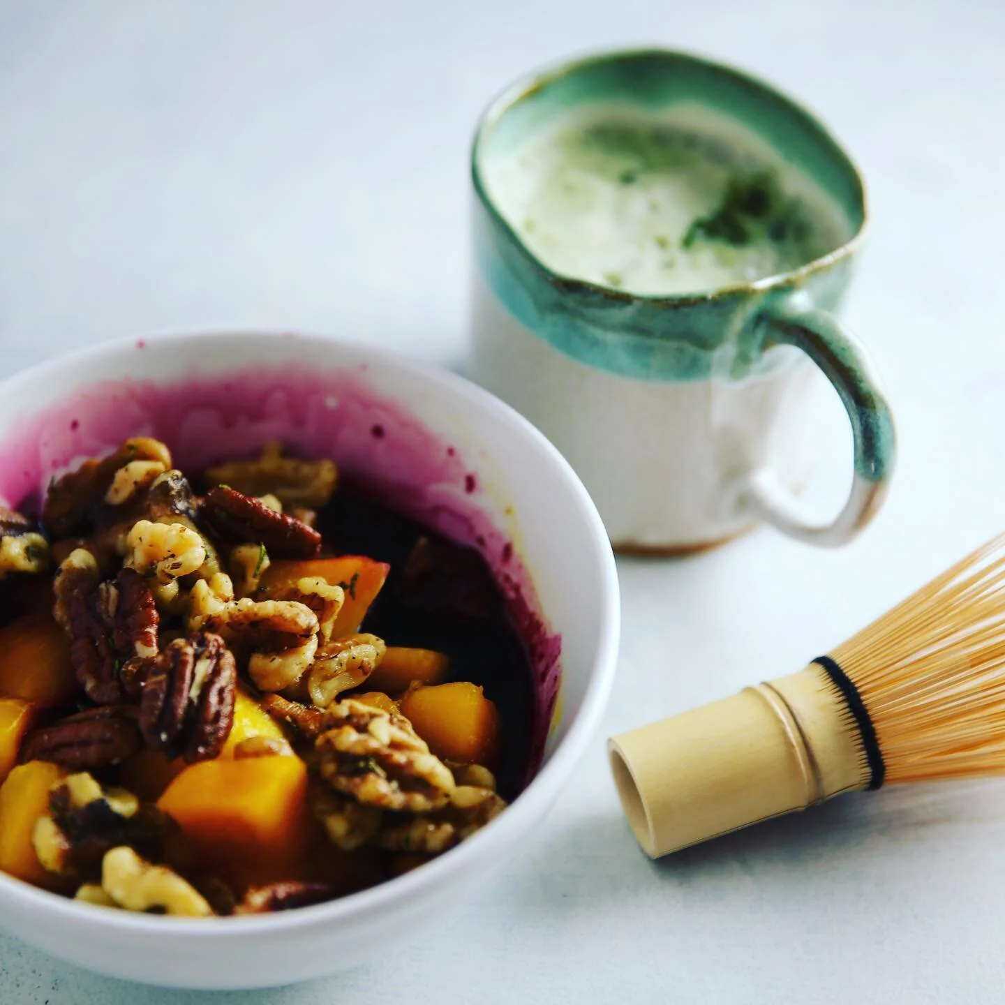 Afternoon pick-me-up: @maedaenus #matcha latte with @threetreesfoods pistachio milk &amp; @lakanto monk fruit sweetener. Plus mango and blueberries topped w/rosemary nuts. I always keep frozen fruit (usually big bags from @wholefoods ) on hand and co