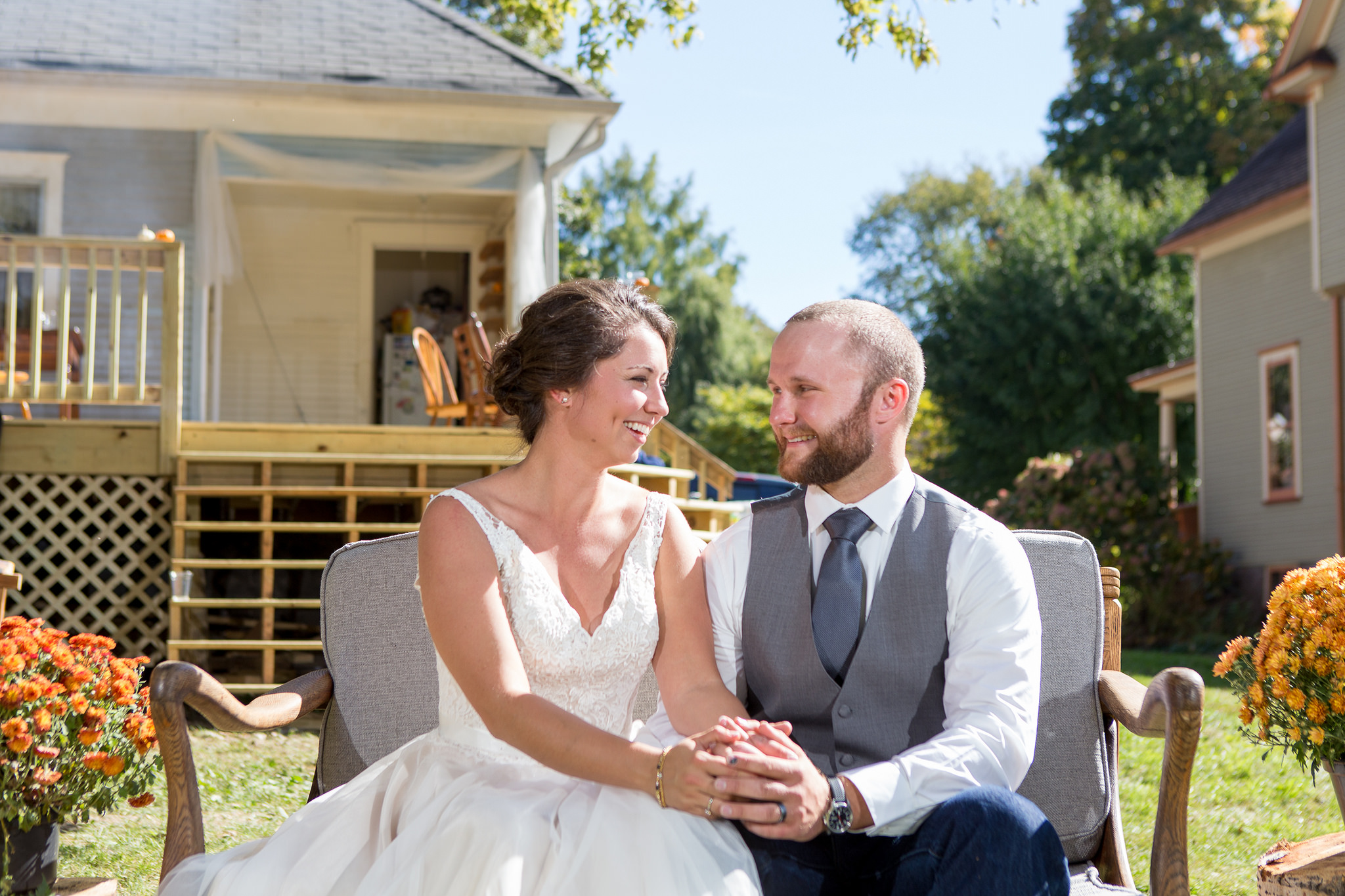 The couple's wedding gift to each other was this refurbished love seat. Derek stripped and refinished the wood and Katrina sewed and upholstered the cushions. 