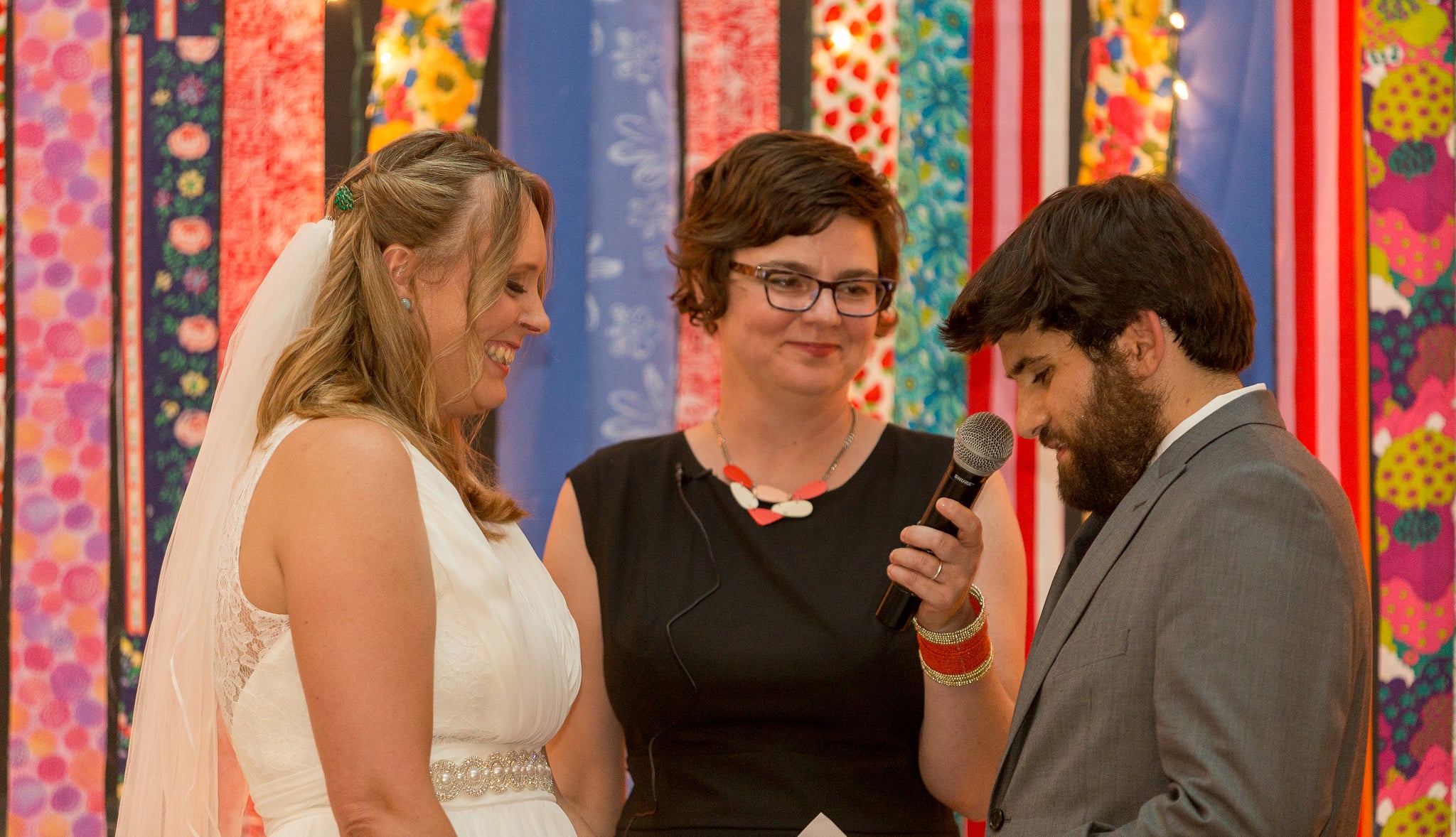 On a warm September day, a few months after the birth of their first child, Theo, Ben & Melissa gathered with scores of friends and family to celebrate their vows and the creation of their new family. The wedding was held in an old movie theater that has been converted to a children's museum and the DIY ceremony backdrop was constructed from fabric Melissa's mother had collected (including her 70s era wedding dress).