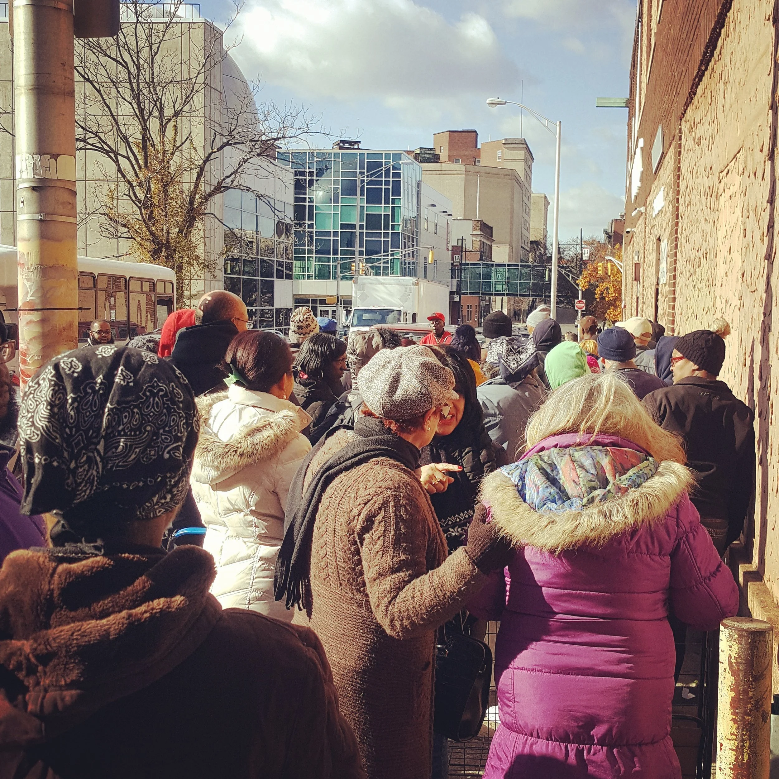 Clients waiting outside of CUMAC’s food pantry during Thanksgiving Week 2017