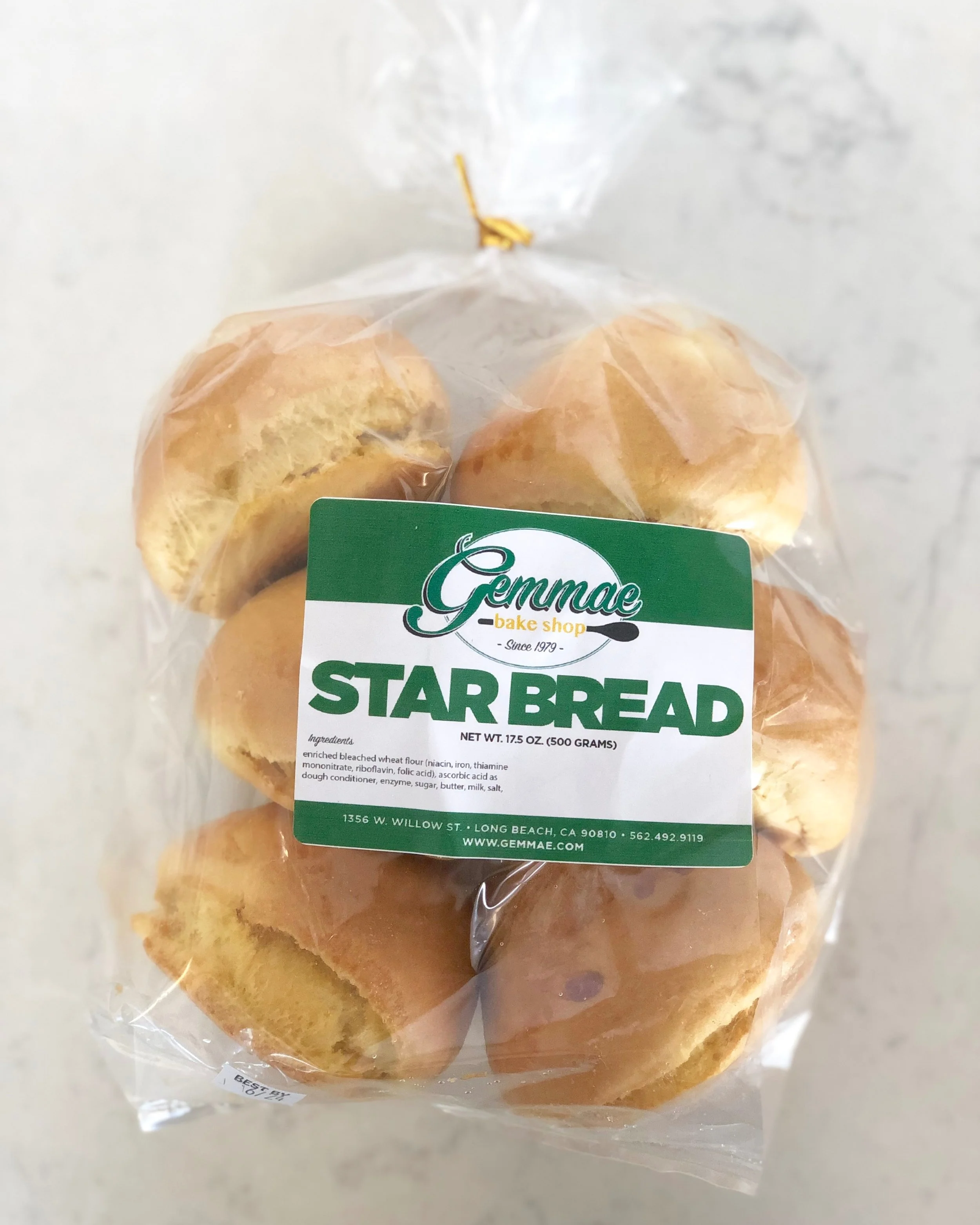 STAR BREAD Dense bread buns topped with a sprinkle of sugar.