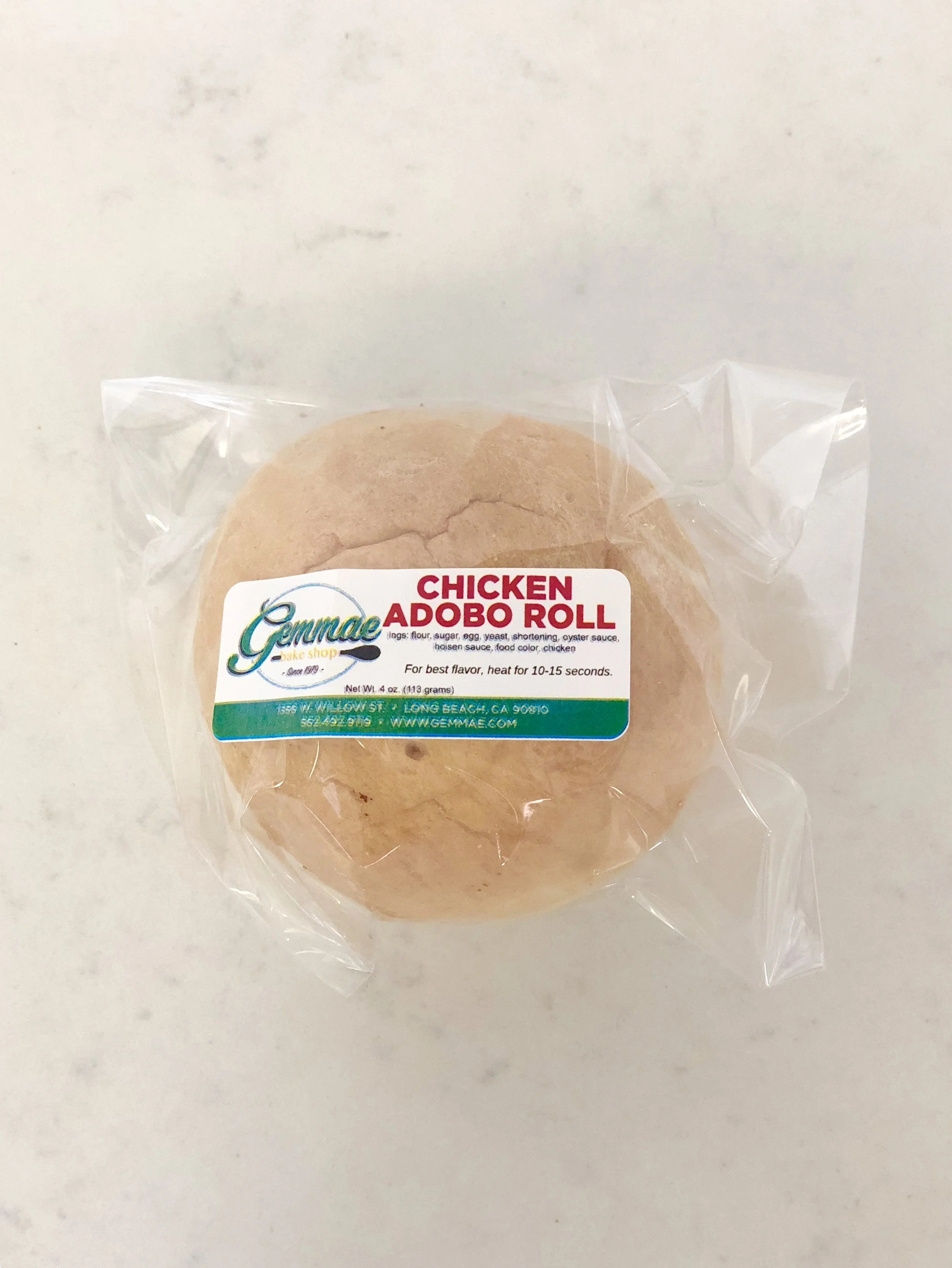 CHICKEN ADOBO ROLL Baked bun filled with our popular Chicken Adobo.