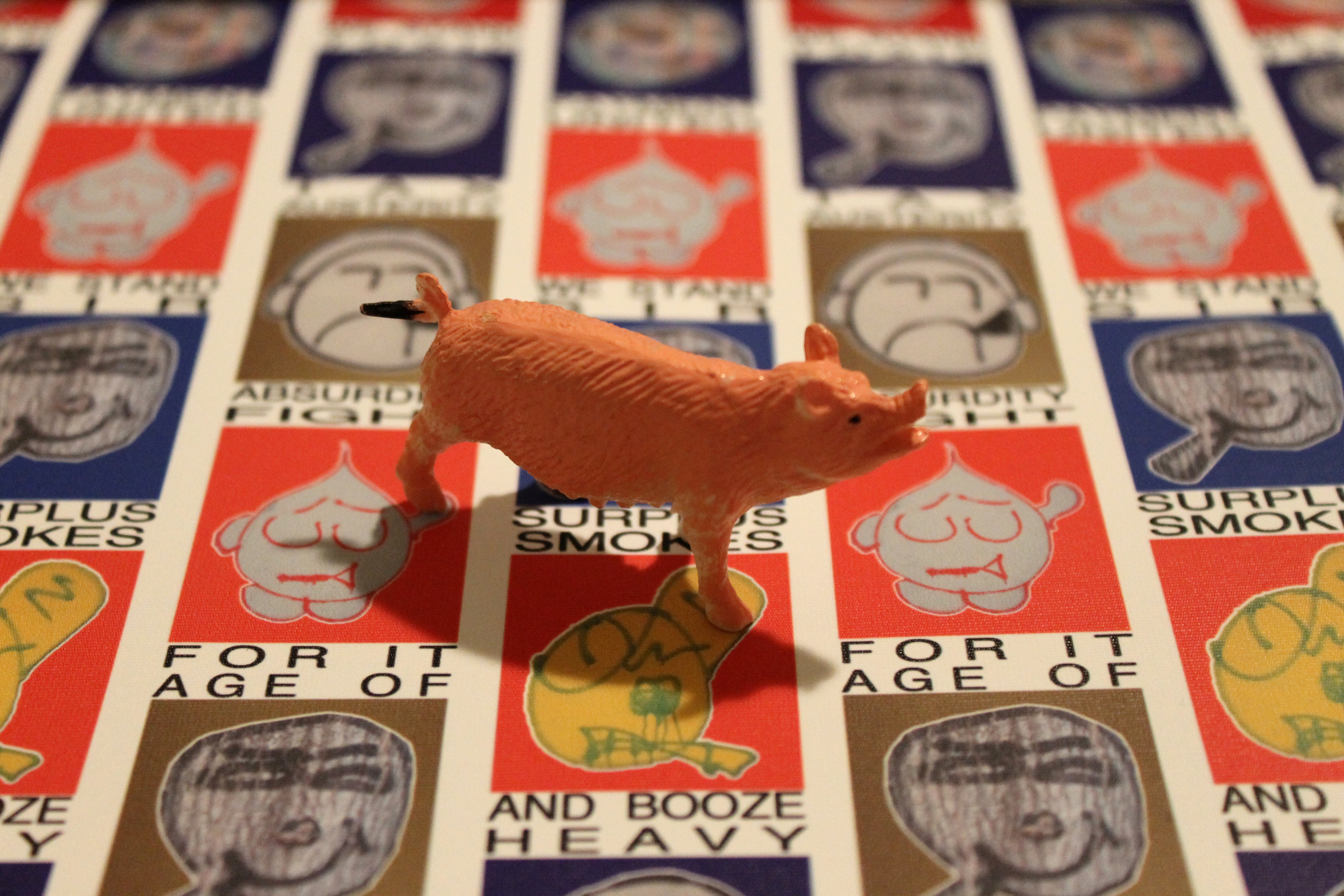 Smokes & wallpaper with plastic pig, 2014