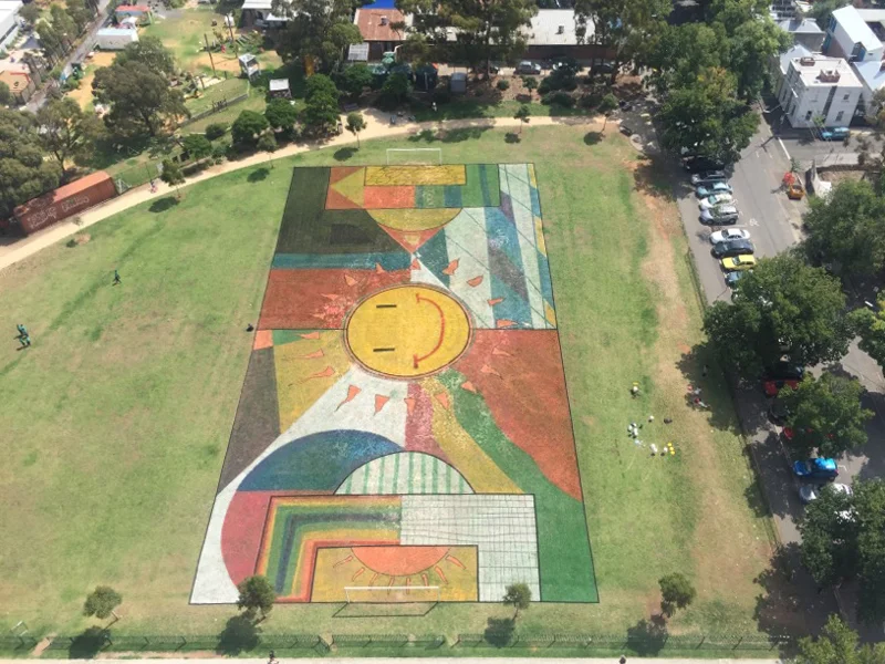 100 number 10's, in collaboration with Fitzroy Primary School at Atherton Gardens, turf linemarking on grass, 2016