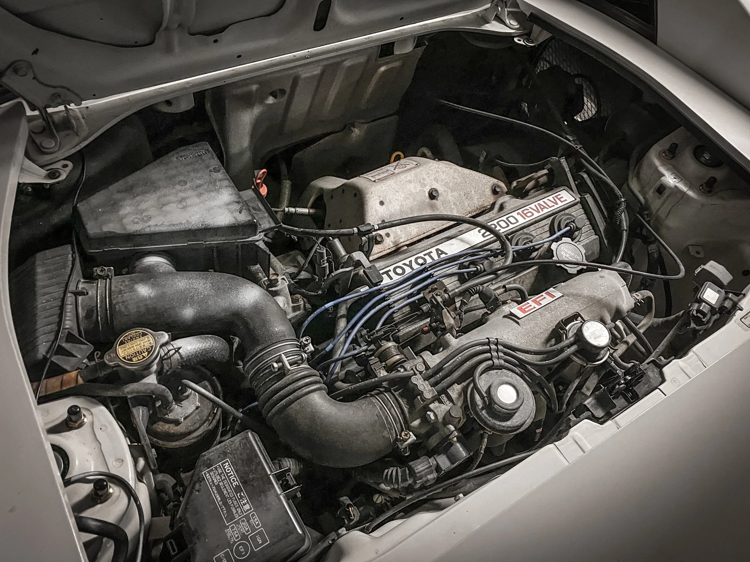    The build grew from there.  The automatic eventually gave way to an E153 manual transmission, the 5S-FE was upgraded to a Gen 4 3S-GTE, the suspension and brakes were completely reworked, the blue interior eventually became black, and the exterior