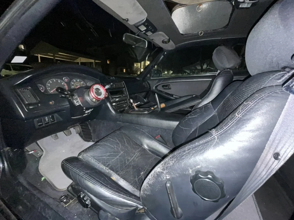  We removed the blue interior from pHa2e while it was still in good condition, restored the black pieces and transferred them into the car. I liked the fact that usable parts from an MR2 that wasn't going to survive could become part of this one. 