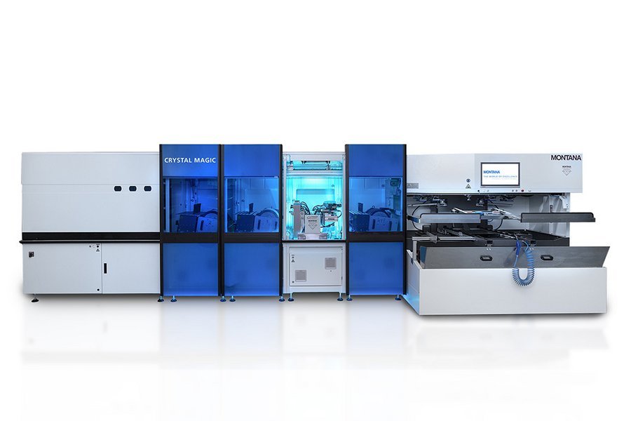 Medical machine labeled CRYSTAL MAGIC and MONTANA with a display screen, various compartments, and blue-tinted protective covers.