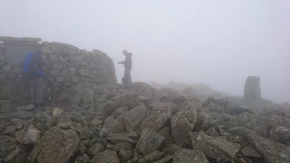 A very cloudy Scafell Pike Summit.