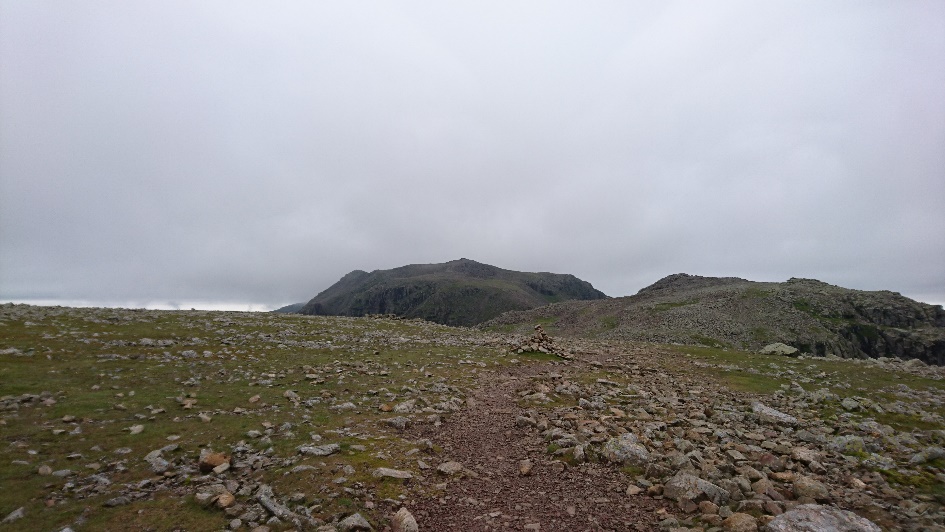Looking back at a now cloud free Scafell Pike Summit.