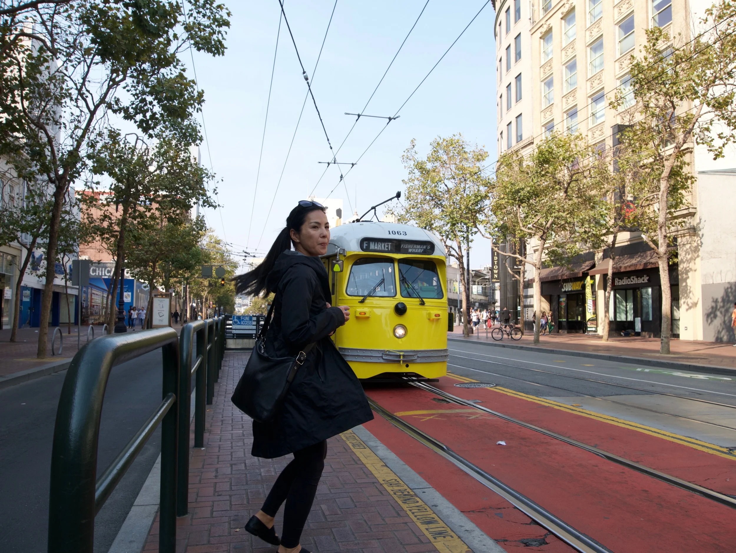 My cute mom on Market Street in San Francisco. Waiting for the "F" Line to go to the morning market at the Ferry Building. 